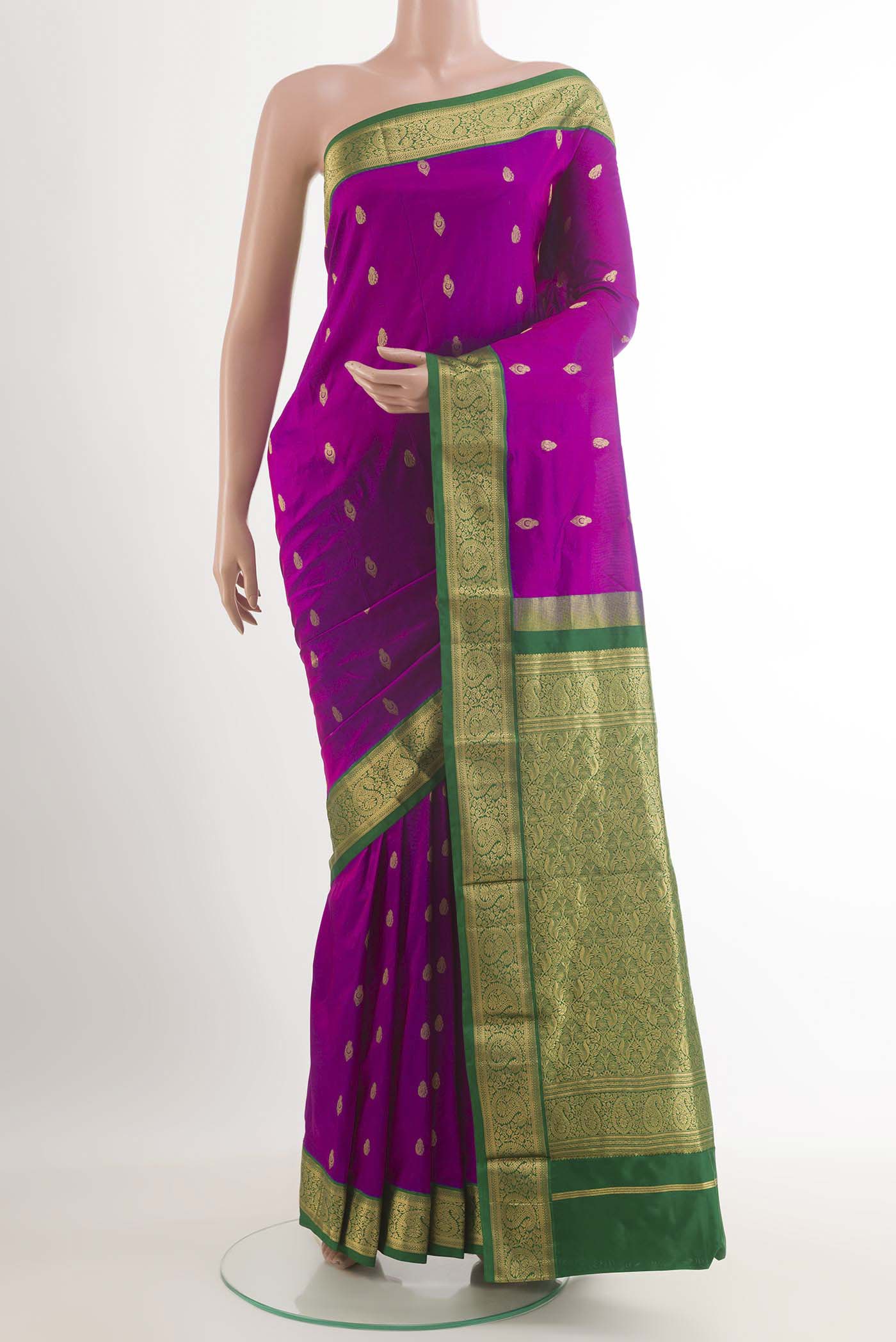 Purple Kanchipuram Silk Saree with Zari Butta on the body and Zari Border.  displayed on a mannequin