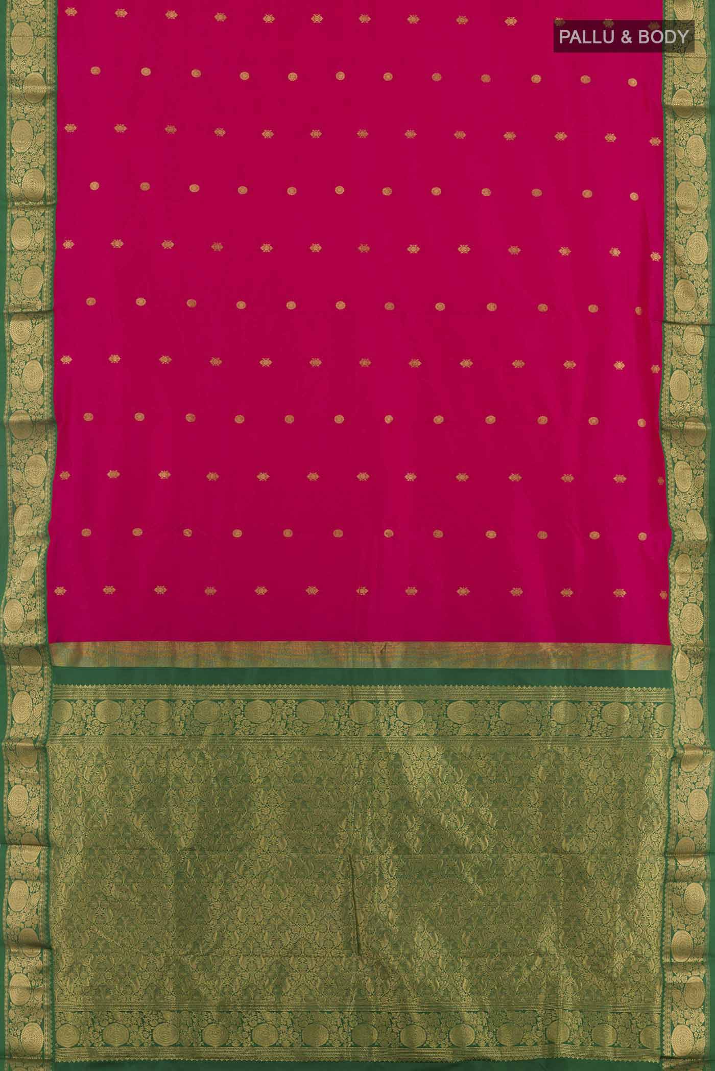 Flat view of Rani Pink Kanchipuram Silk Saree with Zari Butta on the body and Zari Border. 