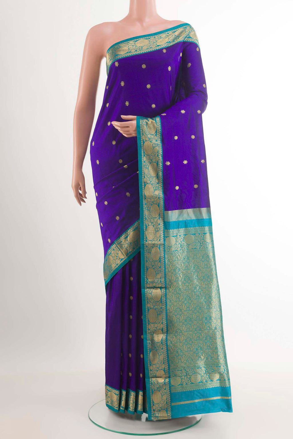 Dark Blue Kanchipuram Silk Saree with Zari Brocade on the body and Zari Border.  displayed on a mannequin