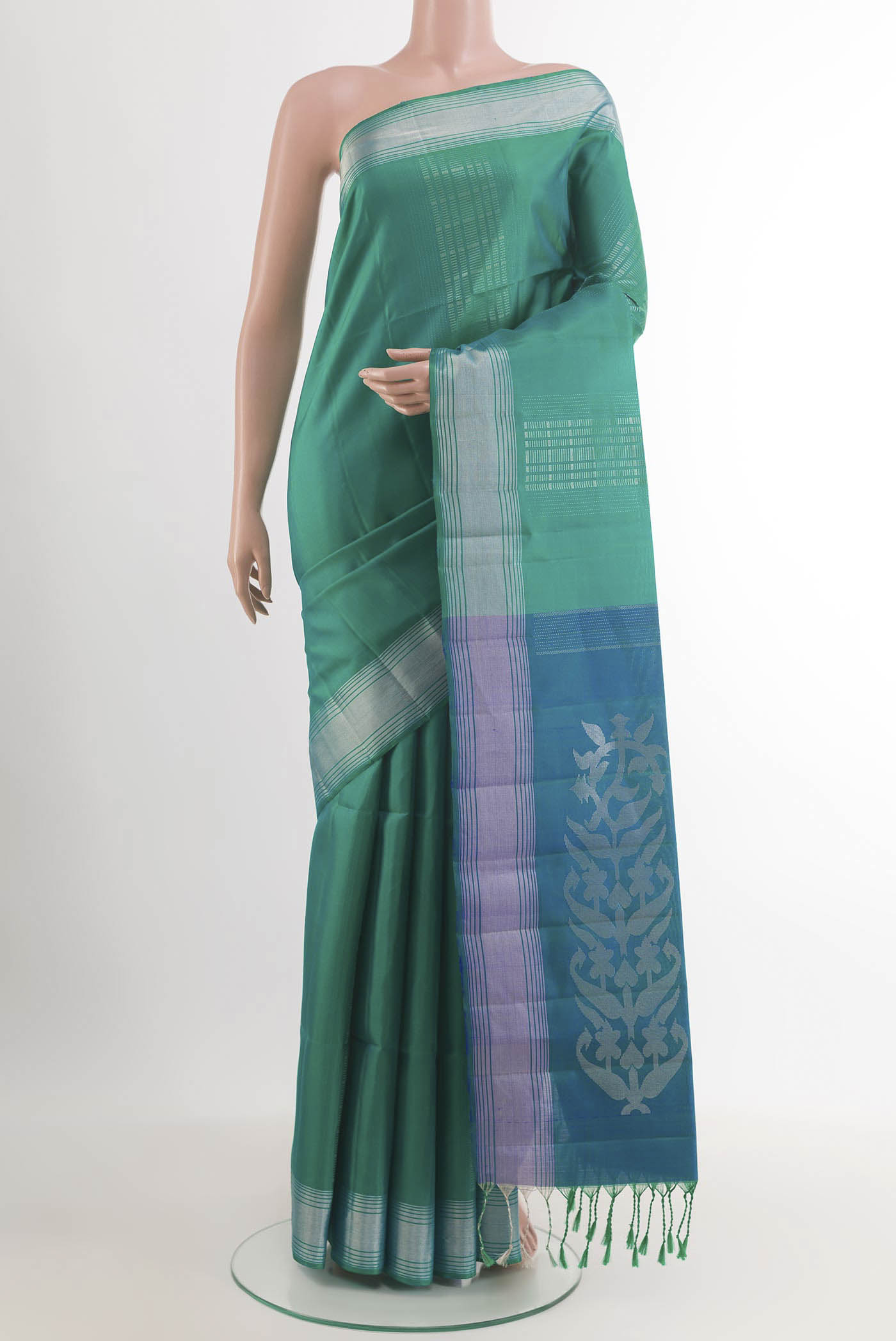 Sea Green Dual Tone Soft Silk Saree with Zari Butta on the body and Zari Border.  displayed on a mannequin