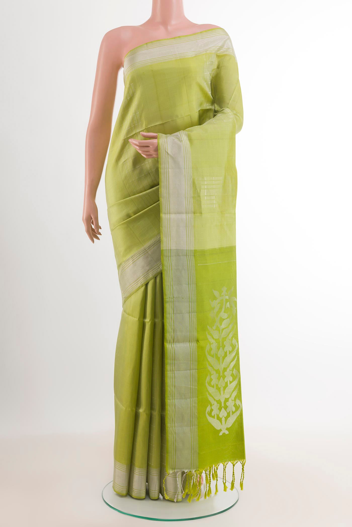 Green Dual Tone Soft Silk Saree with Zari Butta on the body and Zari Border.  displayed on a mannequin