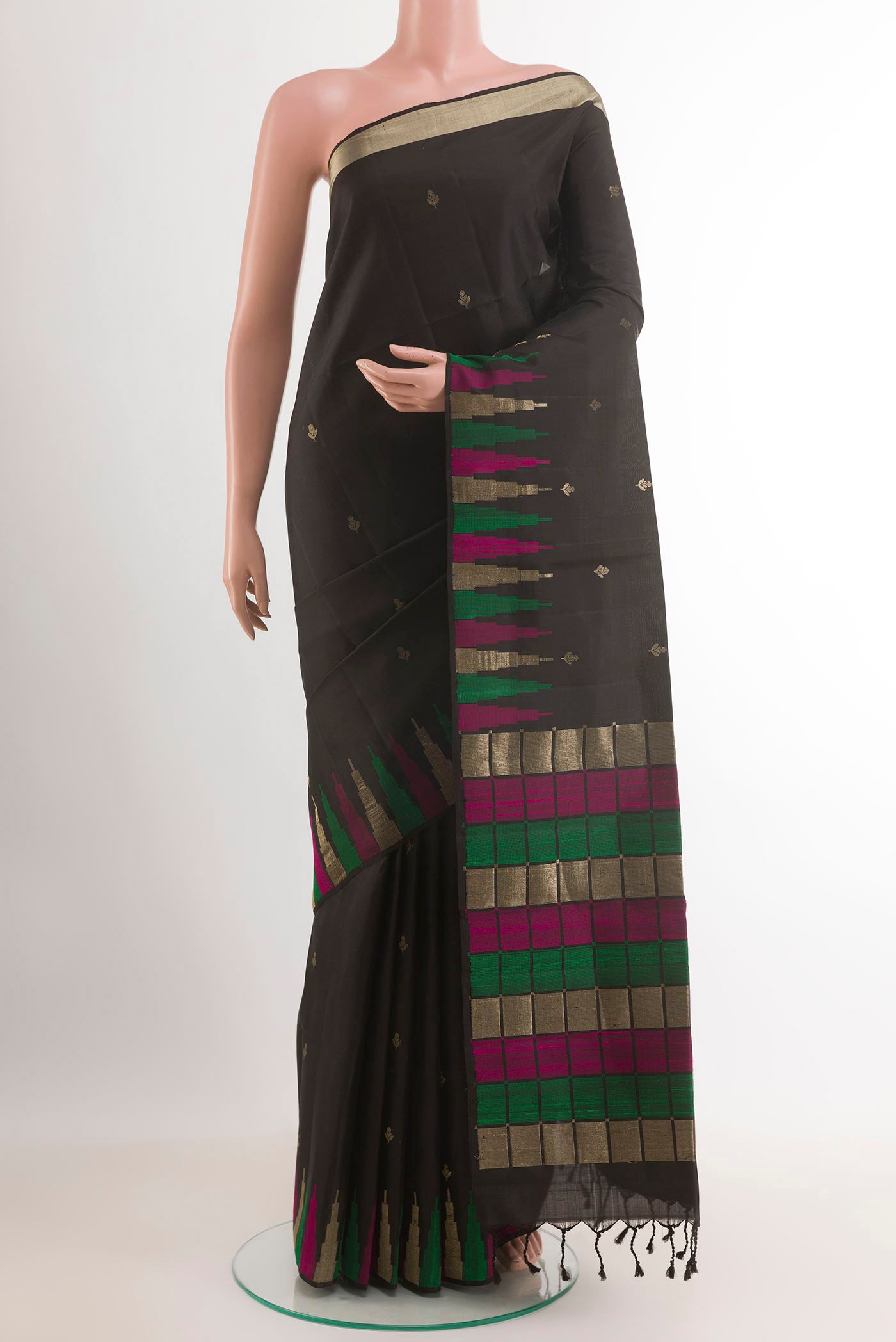 Black Soft Silk Saree with Zari Butta on the body and Zari Border.  displayed on a mannequin