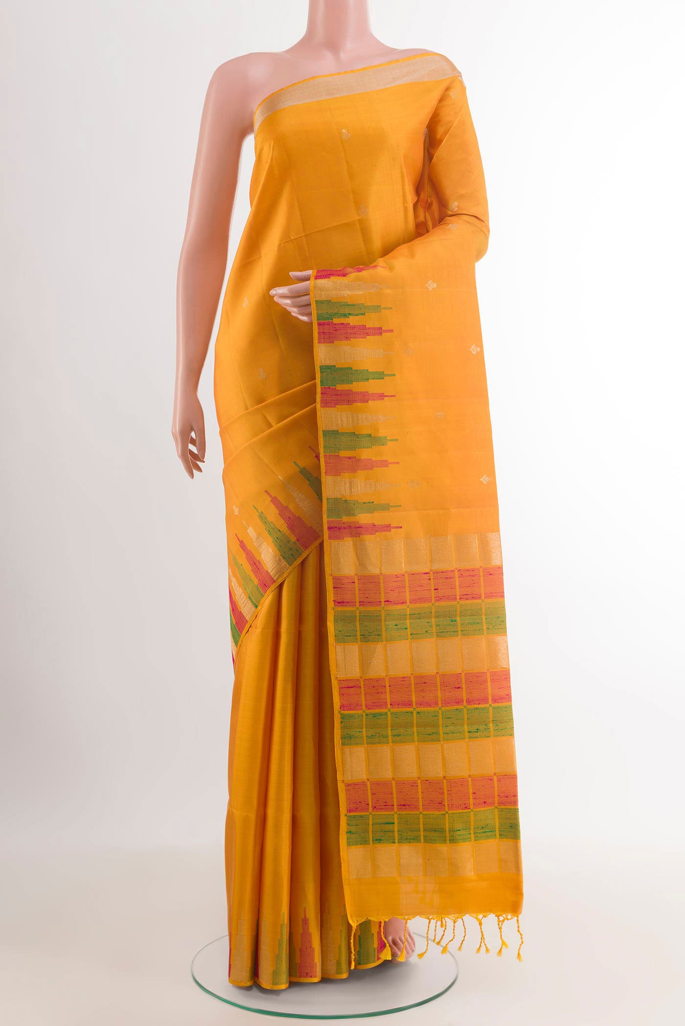 Yellow Soft Silk Saree with Zari Butta on the body and Zari Border.  displayed on a mannequin