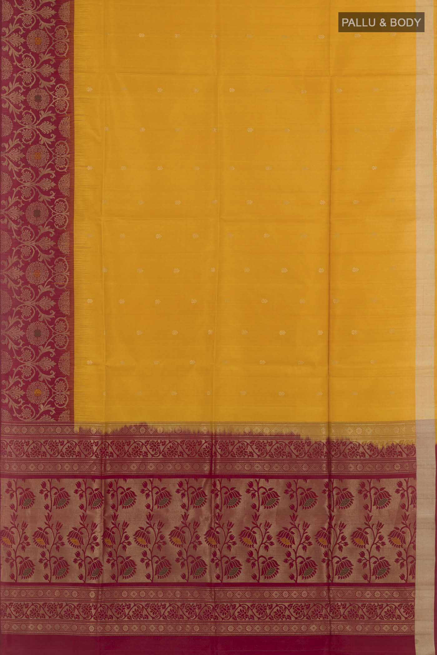 Flat view of Yellow Soft Silk Saree with Zari Butta on the body and Zari Border. 