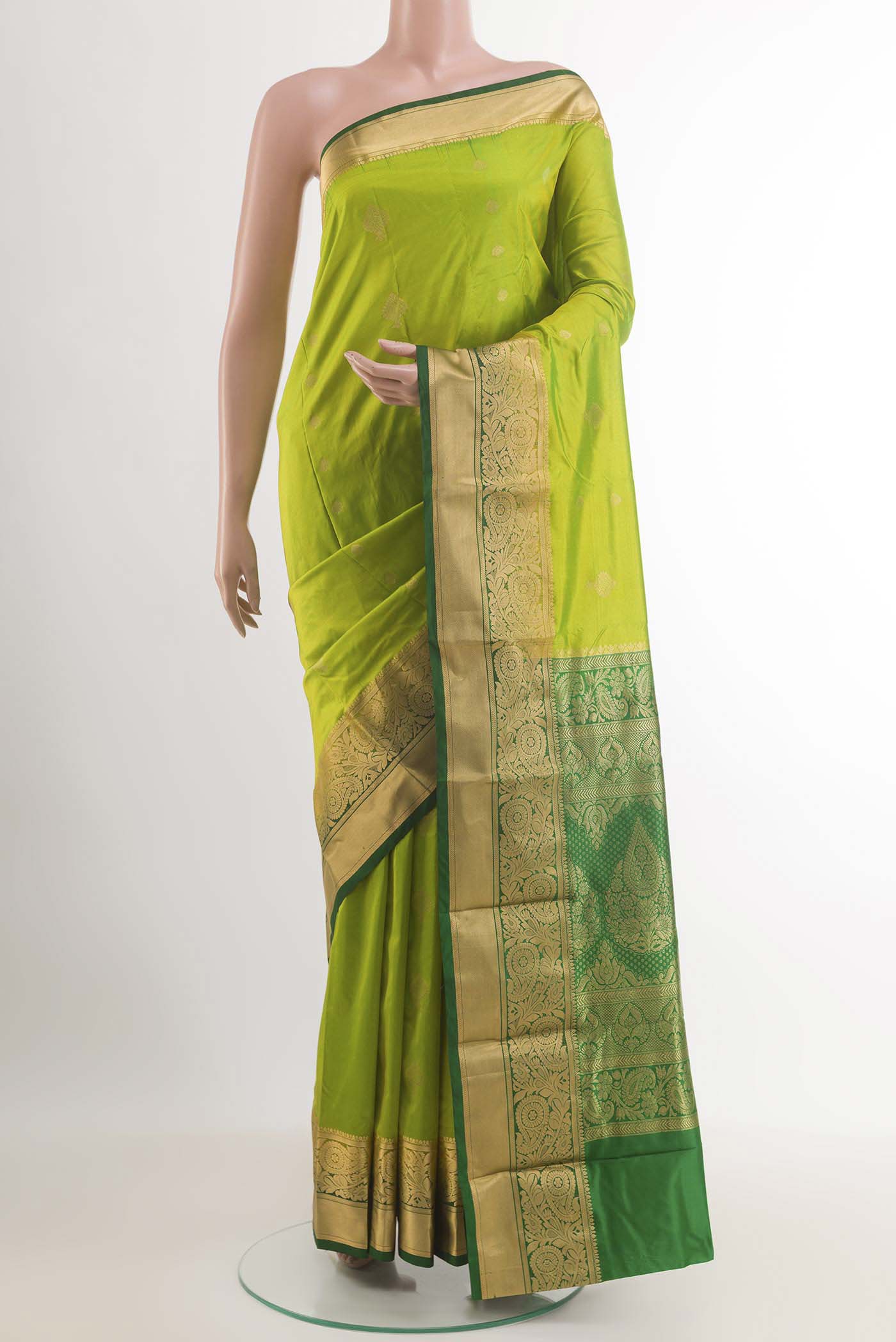 Light Green Dual Tone Kanchipuram Silk Saree with Zari Butta on the body and Zari Border.  displayed on a mannequin