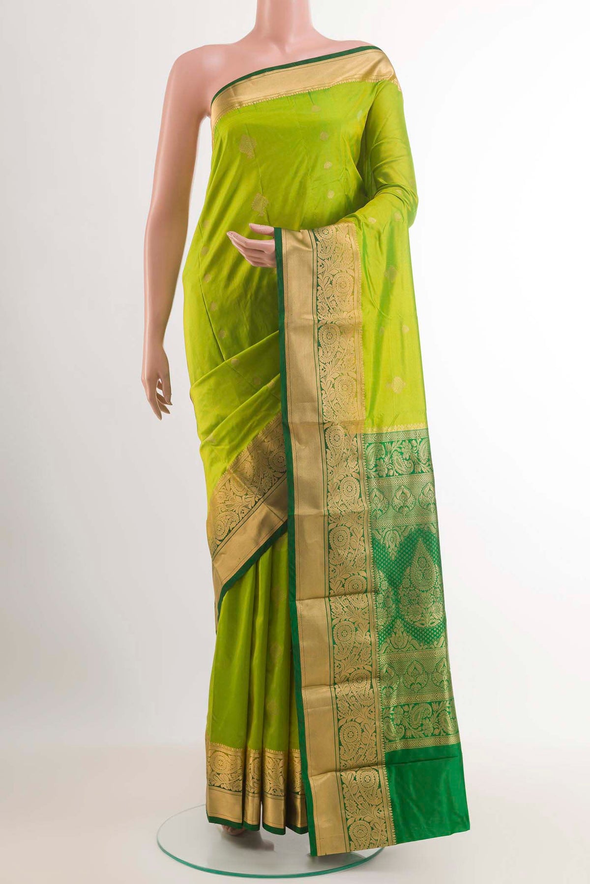 Light Green Dual Tone Kanchipuram Silk Saree with Zari Butta on the body and Zari Border.  displayed on a mannequin