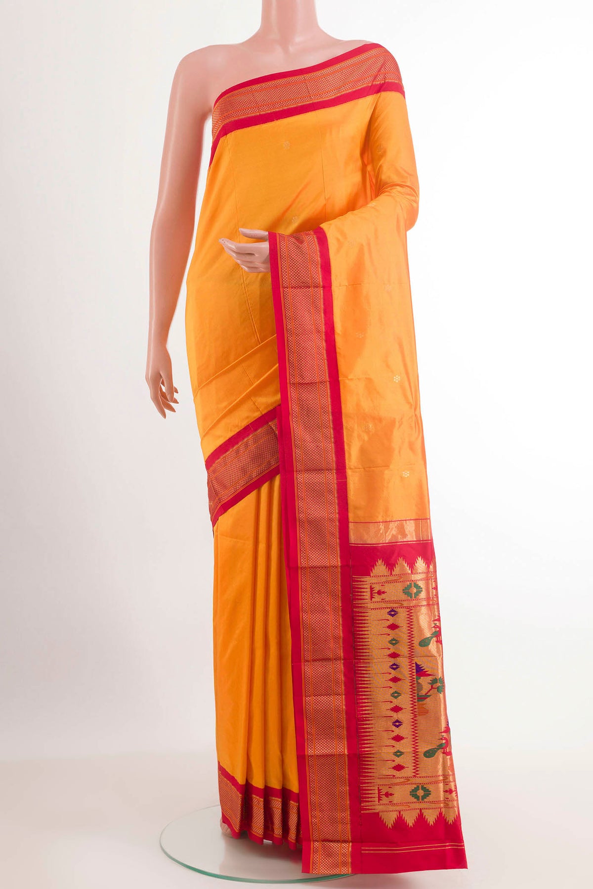 Yellow Gadwal Silk Saree with Zari Butta on the body and Zari Border.  displayed on a mannequin