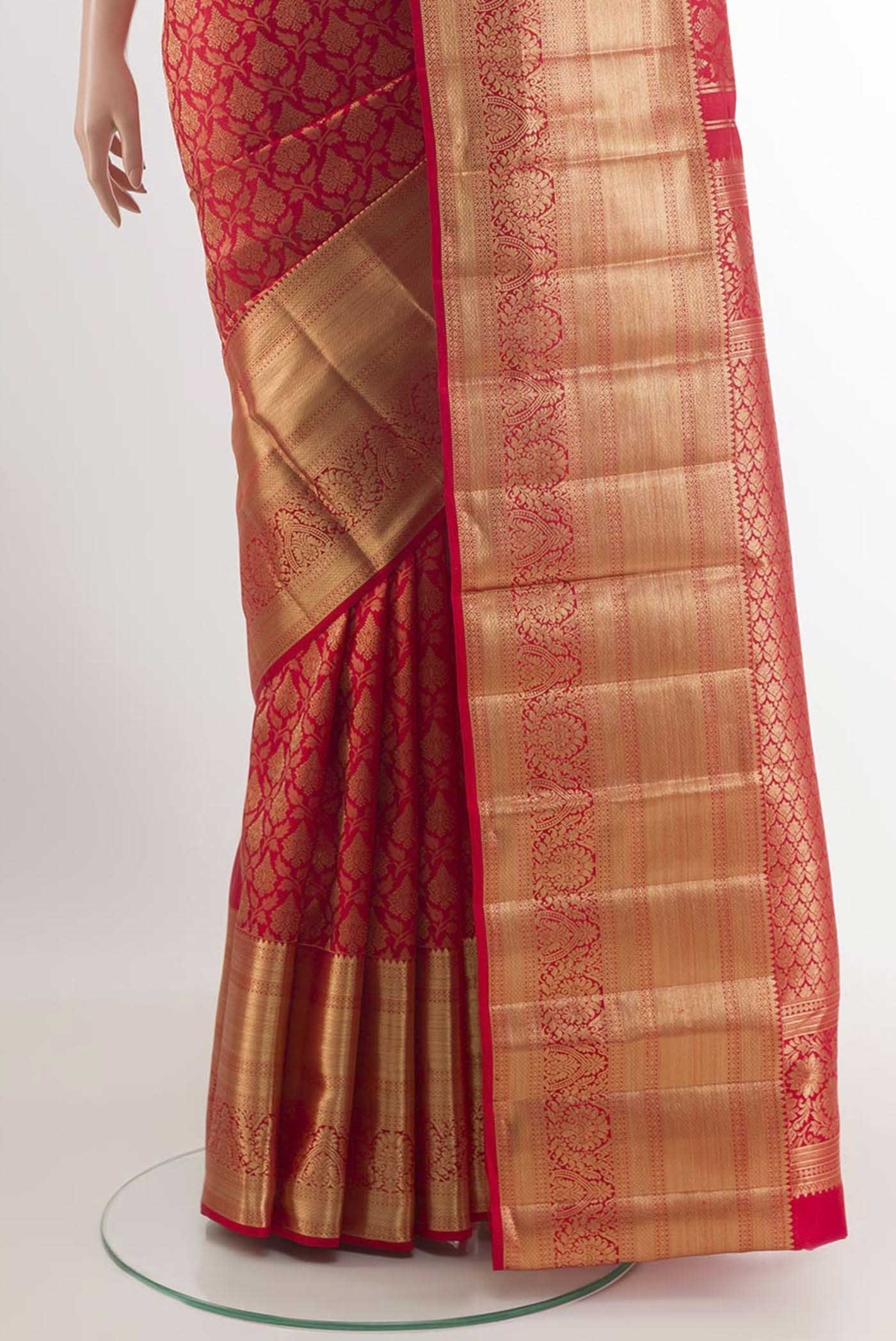 Pleats and pallu of Red Kanchipuram Silk Saree with Zari Brocade on the body and Zari Border. 