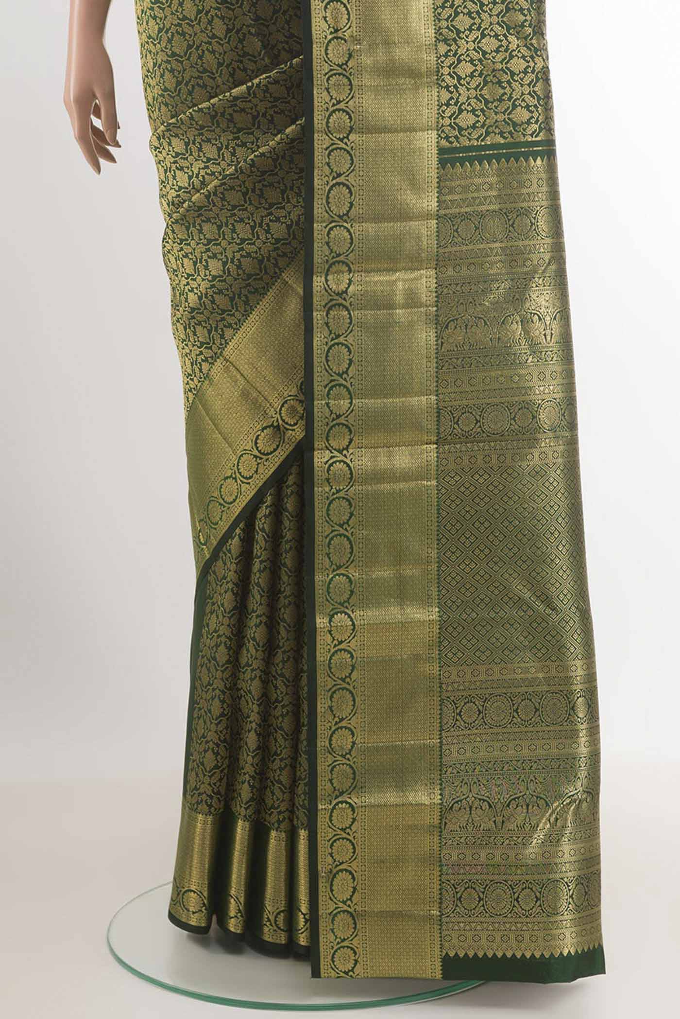 Pleats and pallu of Bottle Green Kanchipuram Silk Saree with Zari Brocade on the body and Zari Border. 