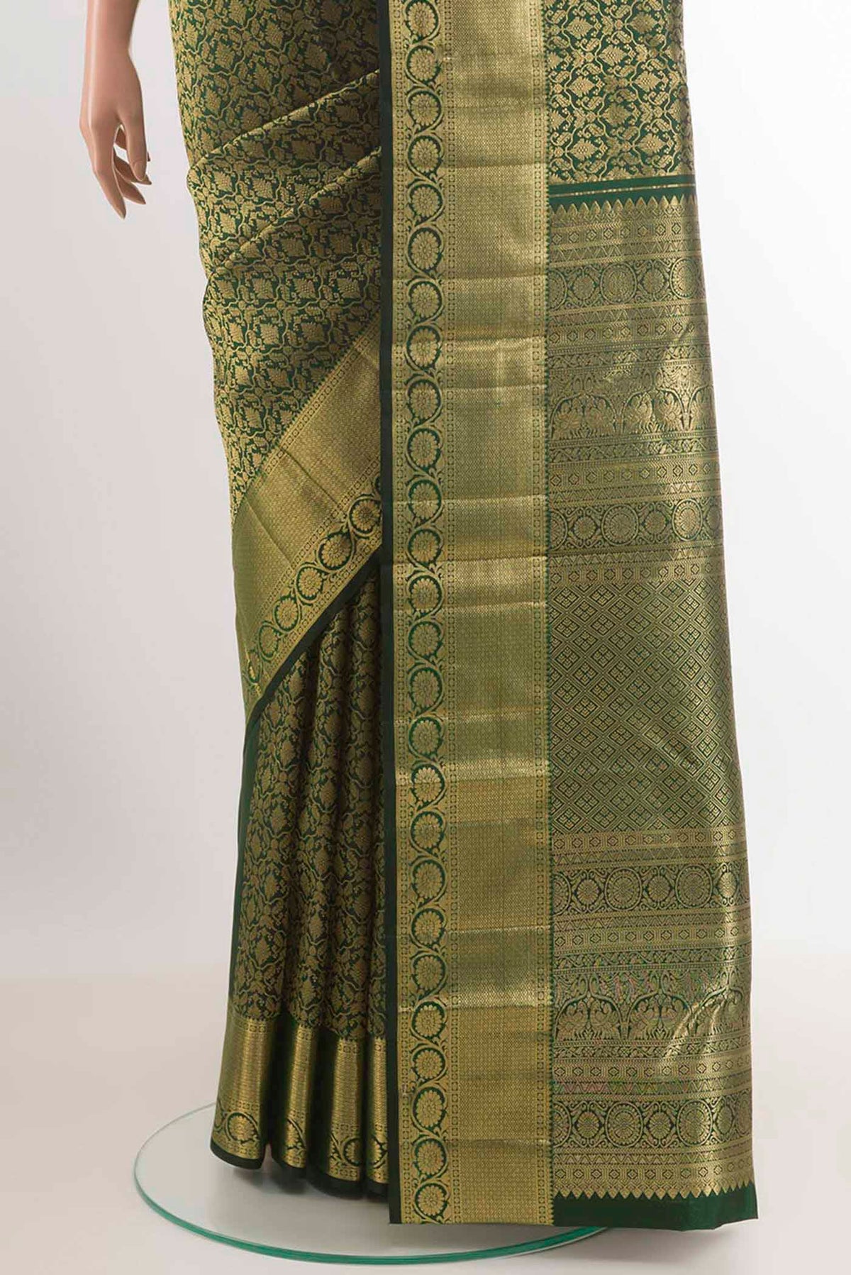 Pleats and pallu of Bottle Green Kanchipuram Silk Saree with Zari Brocade on the body and Zari Border. 