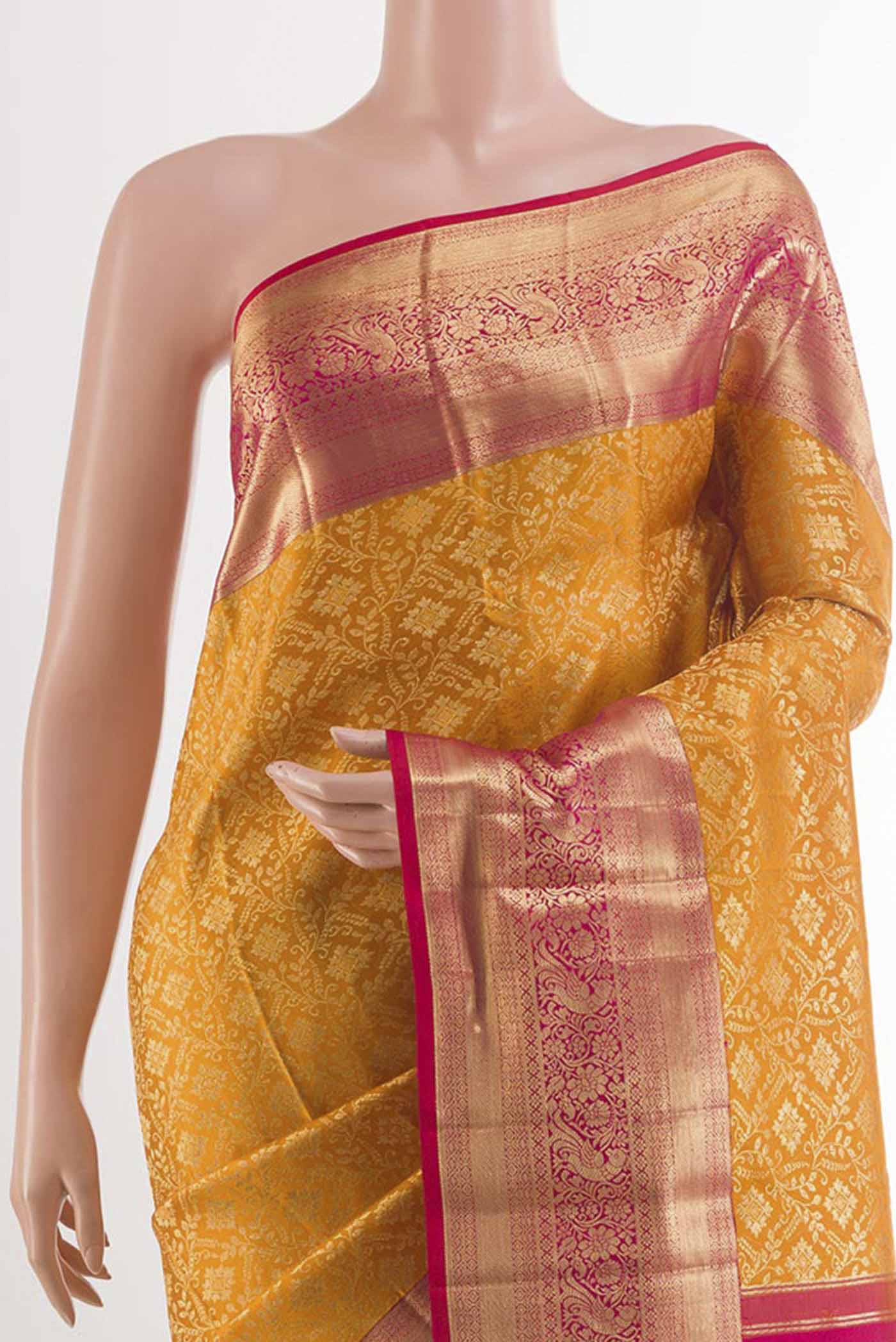 Border image of Yellow Kanchipuram Silk Saree with Zari Brocade on the body and Zari Border. 