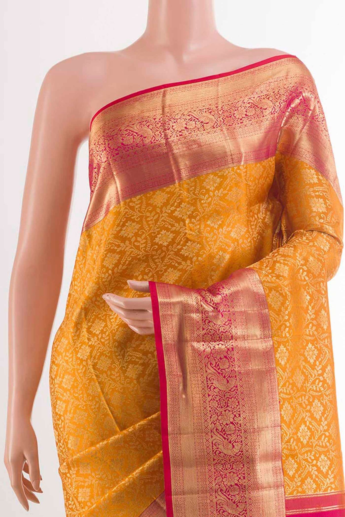 Border image of Yellow Kanchipuram Silk Saree with Zari Brocade on the body and Zari Border. 