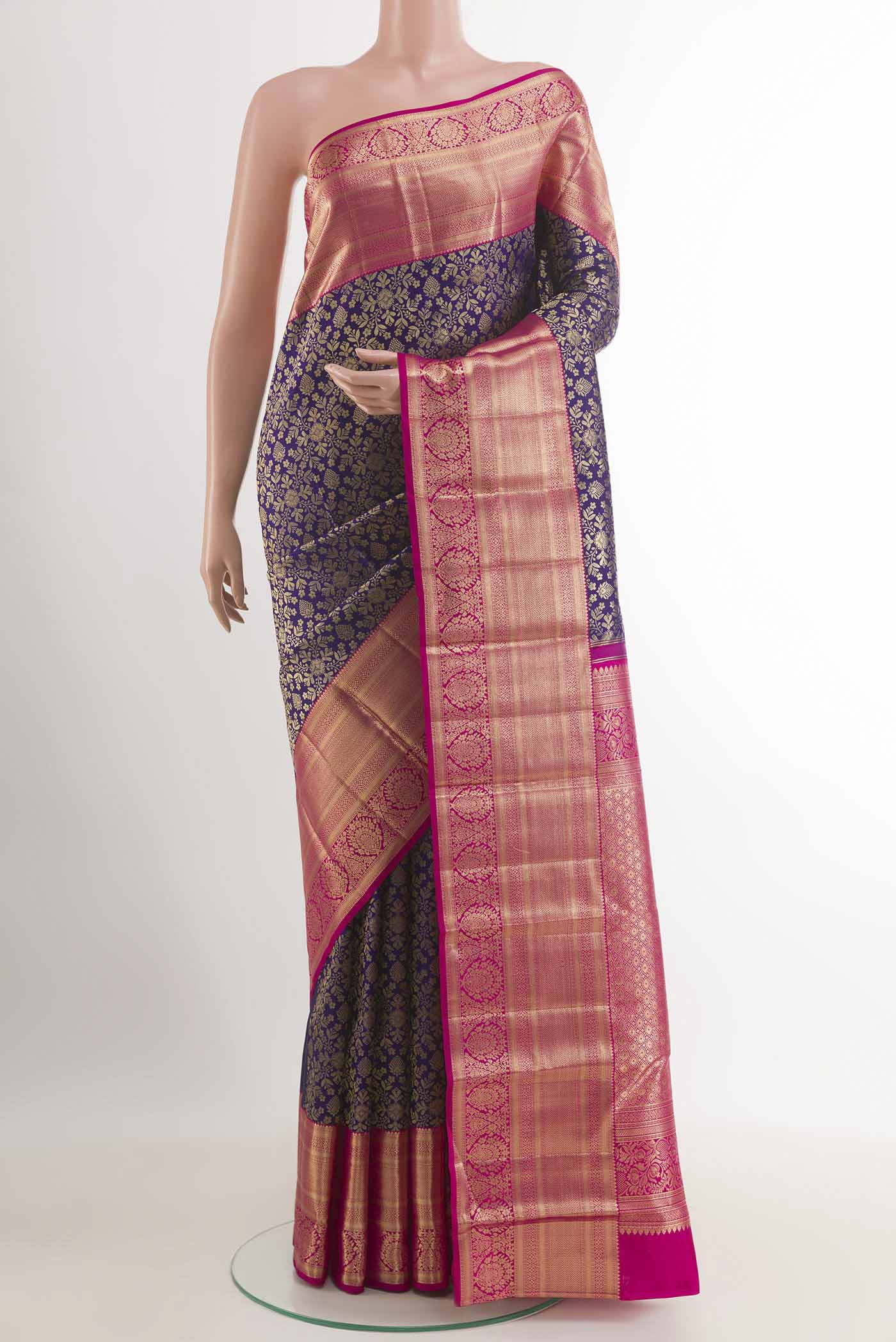 Dark Blue Kanchipuram Silk Saree with Zari Brocade on the body and Zari Border.  displayed on a mannequin