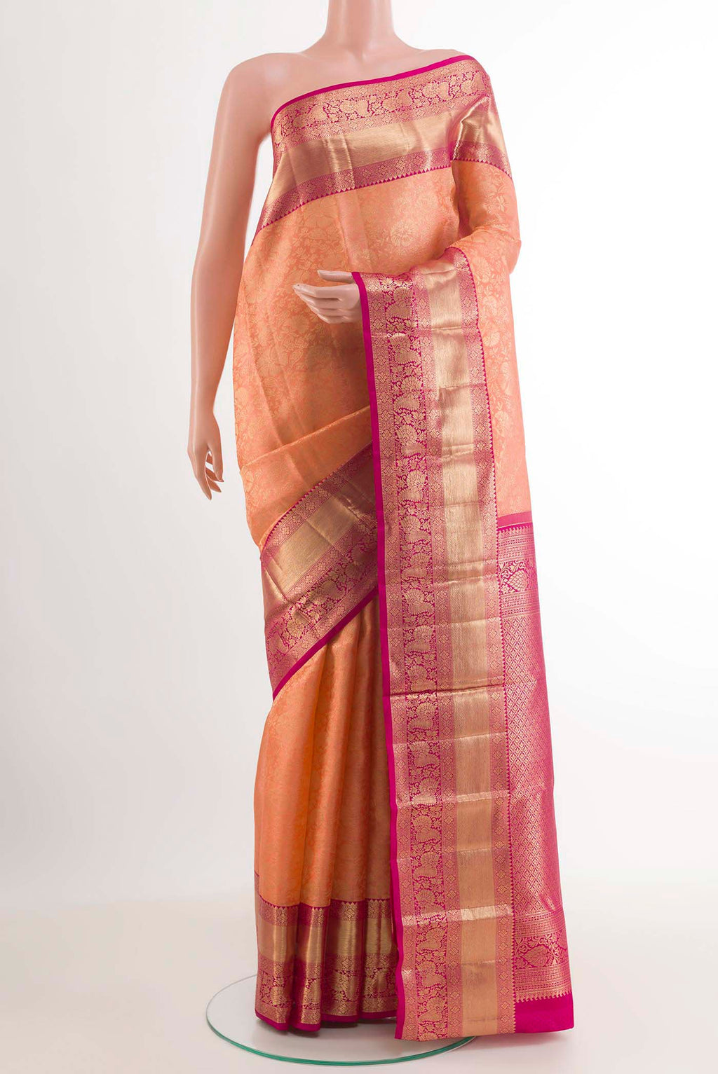 Rose pink Kanchipuram Silk Saree with Zari Brocade on the body and Zari Border.  displayed on a mannequin