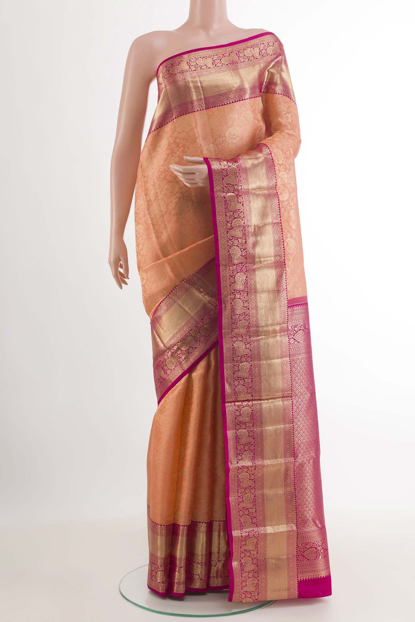 Rose pink Kanchipuram Silk Saree with Zari Brocade on the body and Zari Border.  displayed on a mannequin