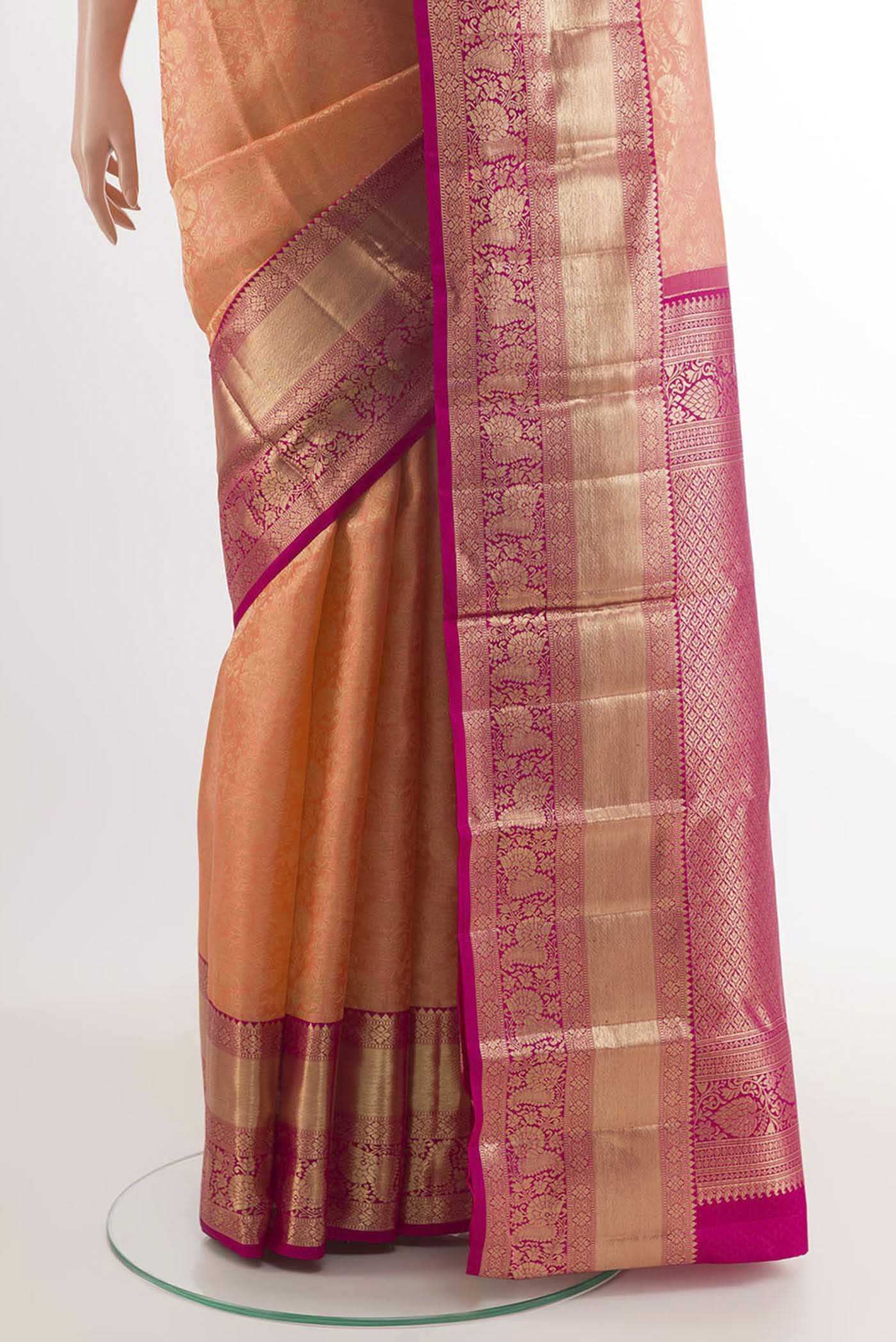Pleats and pallu of Rose pink Kanchipuram Silk Saree with Zari Brocade on the body and Zari Border. 