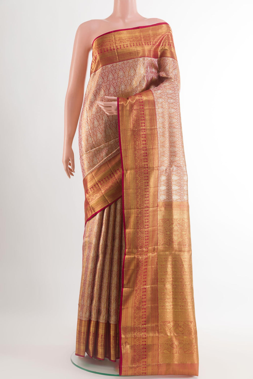 Golden Peach Kanjivaram Tissue Silk Saree with Zari Brocade on the body and Zari Border.  displayed on a mannequin