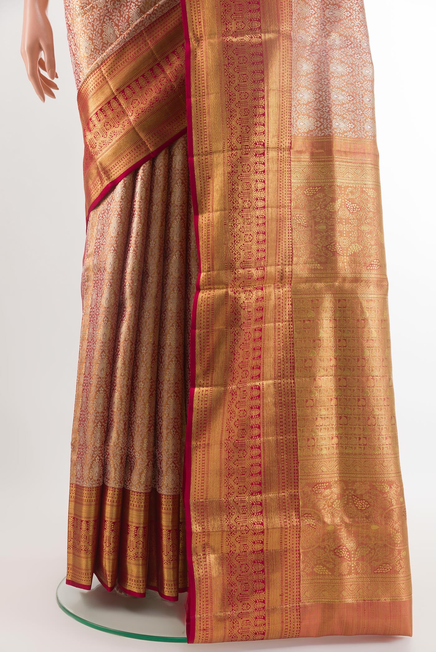 Pleats and pallu of Golden Peach Kanjivaram Tissue Silk Saree with Zari Brocade on the body and Zari Border. 