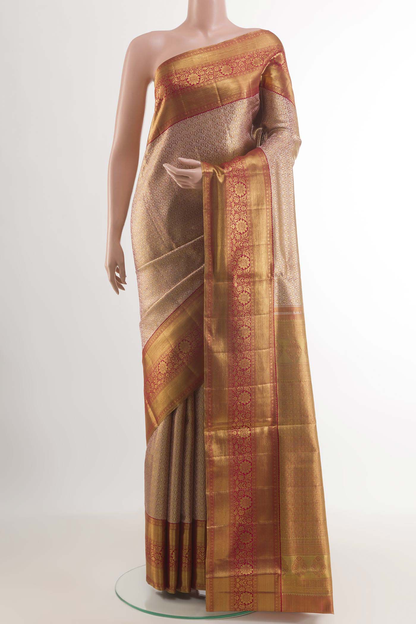 Golden Peach Kanjivaram Silk Saree with Zari Brocade on the body and Zari Border.  displayed on a mannequin