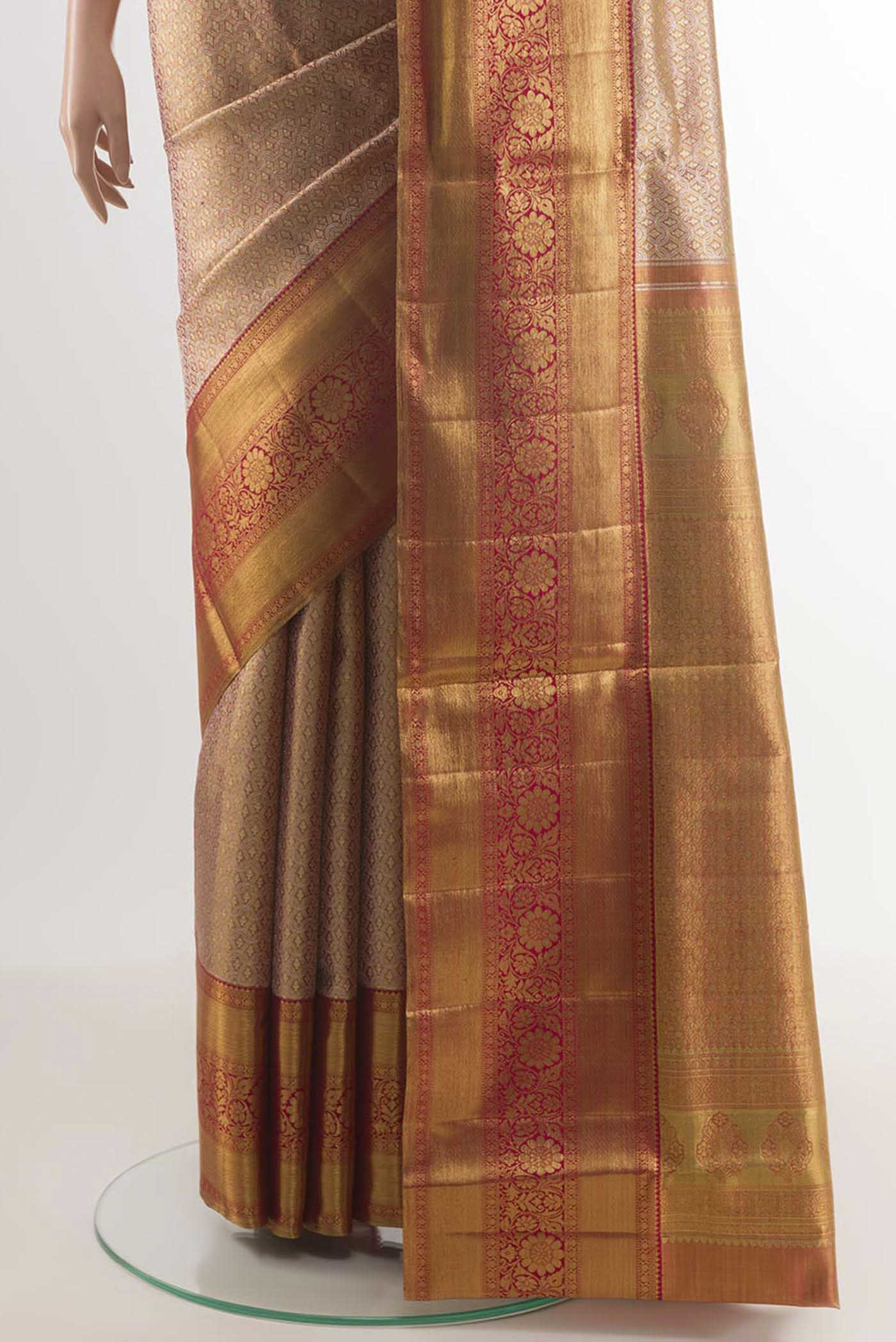 Pleats and pallu of Golden Peach Kanjivaram Silk Saree with Zari Brocade on the body and Zari Border. 