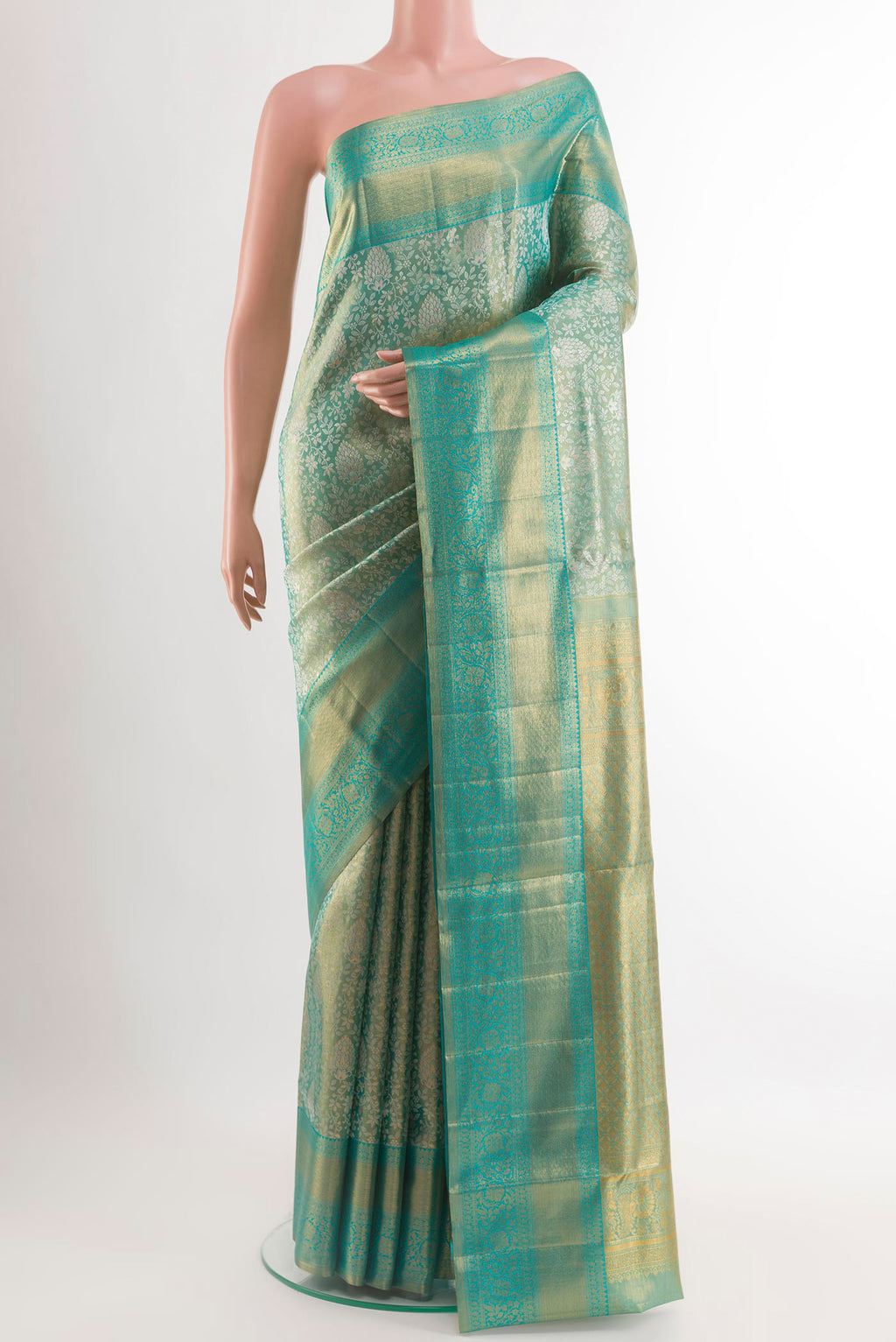 Sea Green Kanjivaram Tissue Silk Saree with Zari Brocade on the body and Zari Border.  displayed on a mannequin