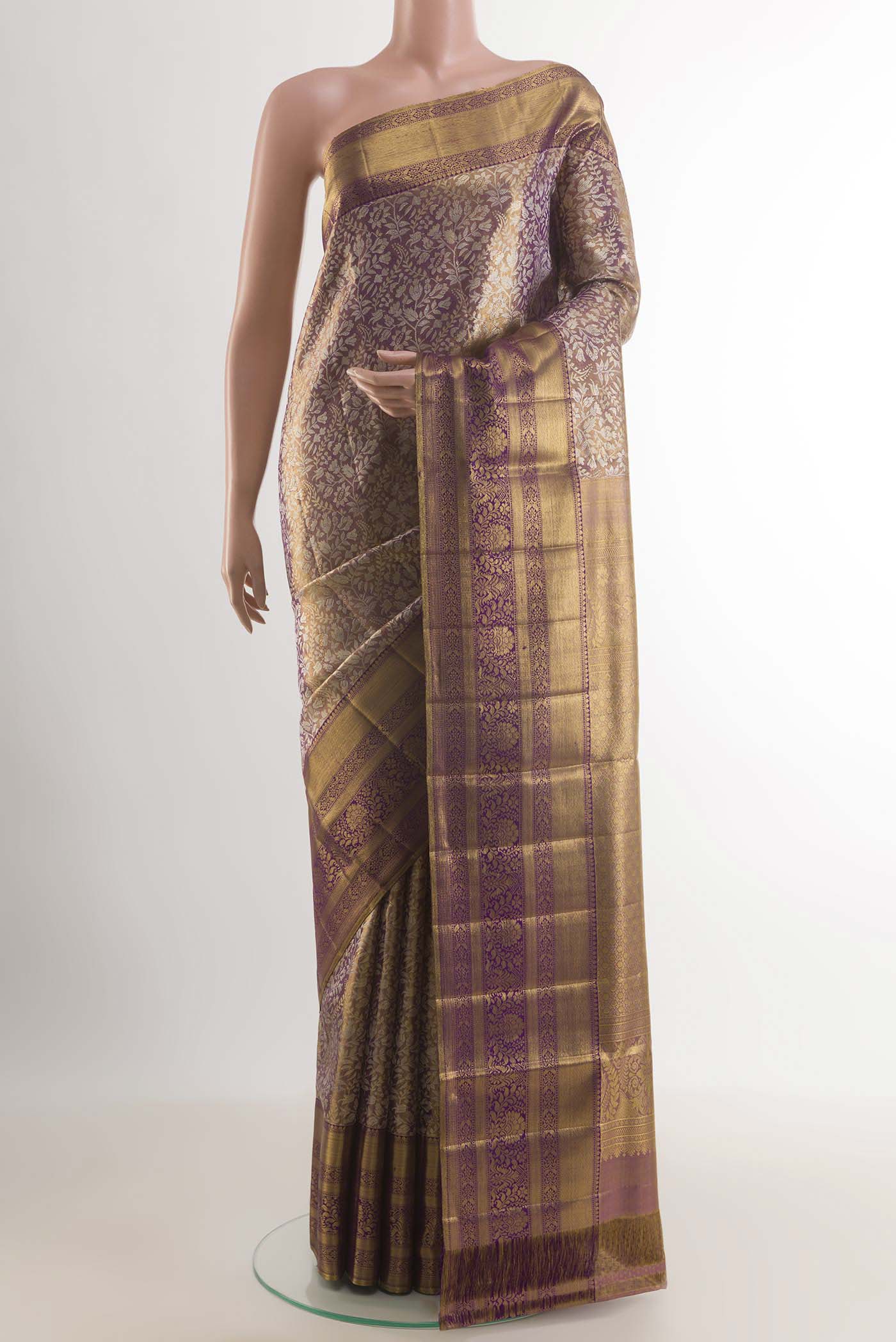 Purple Kanjivaram Silk Saree with Zari Brocade on the body and Zari Border.  displayed on a mannequin
