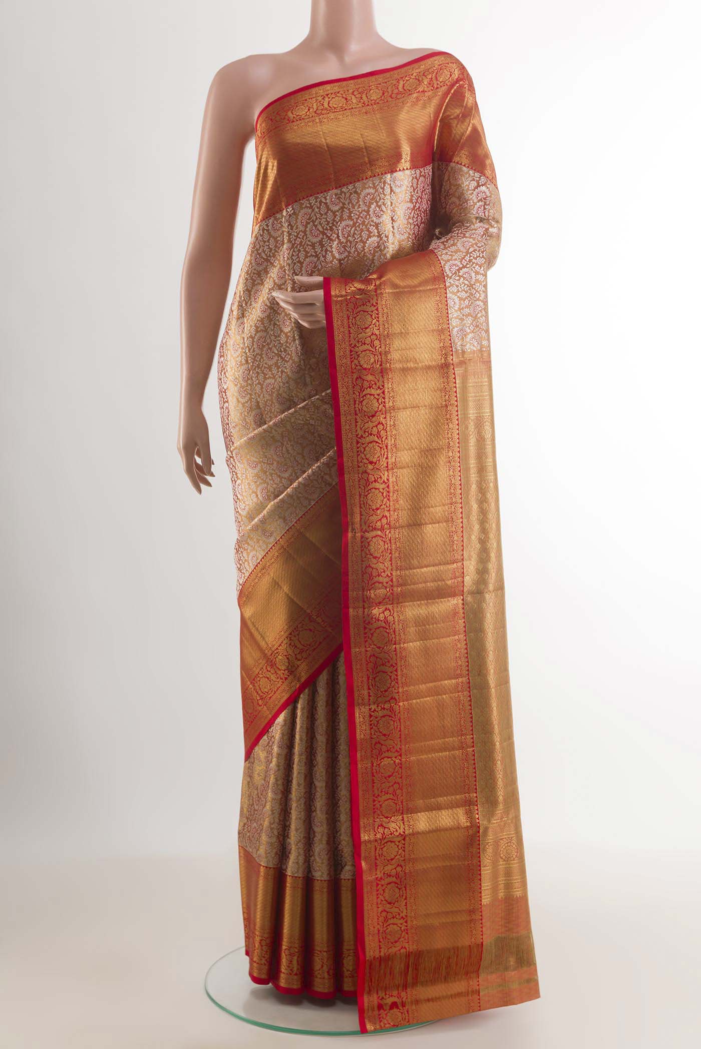Rose Gold Kanjivaram Silk Saree with Zari Butta on the body and Zari Border.  displayed on a mannequin