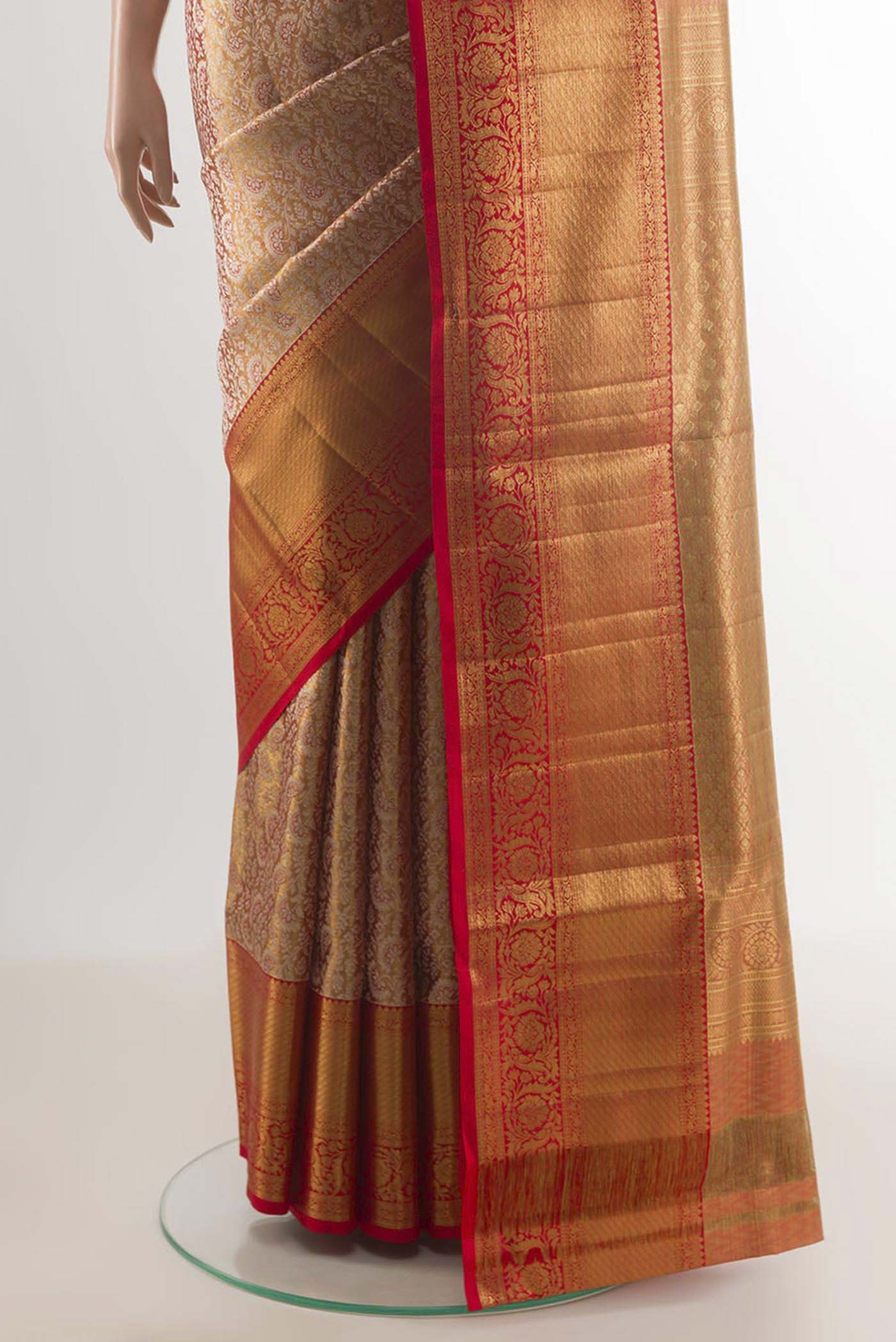 Pleats and pallu of Rose Gold Kanjivaram Silk Saree with Zari Butta on the body and Zari Border. 