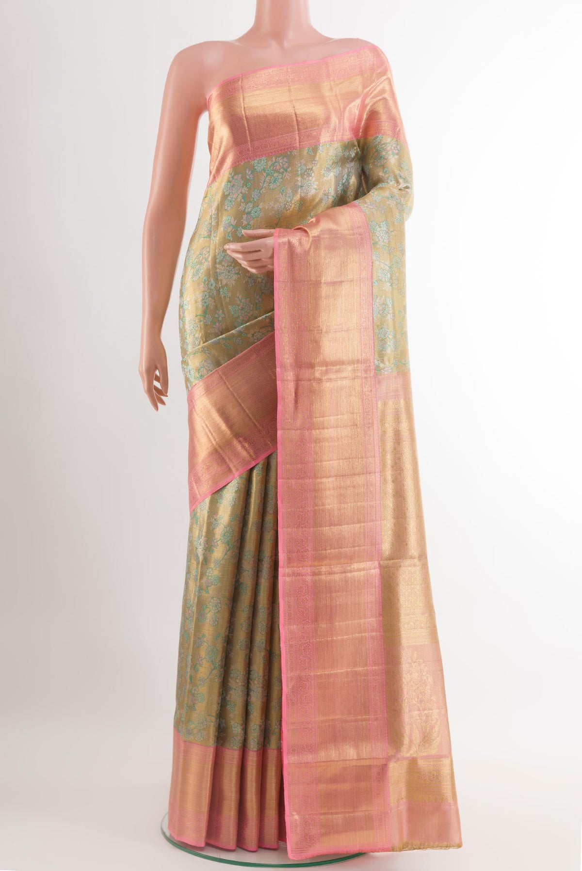 Golden Kanjivaram Tissue Silk Saree with Zari Brocade on the body and Zari Border.  displayed on a mannequin