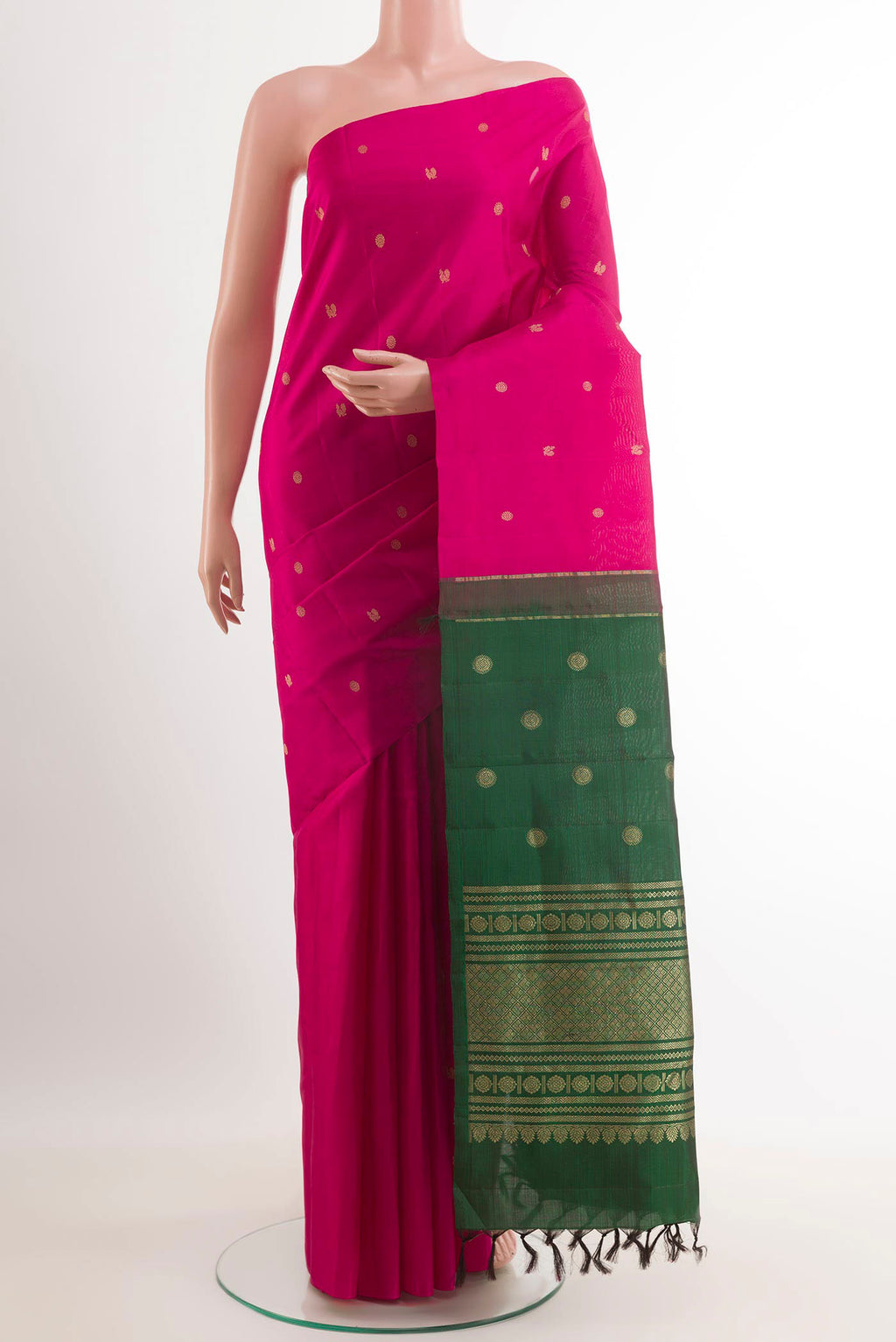 Rani Pink Kanchipuram Silk Saree with Zari Butta on the body and Zari Border.  displayed on a mannequin