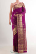 Purple Kanchipuram Silk Saree with Zari Butta on the body and Zari Border.  displayed on a mannequin