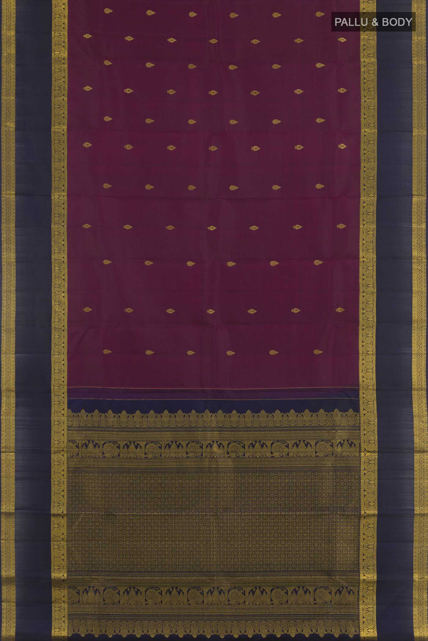 Flat view of Purple Kanchipuram Silk Saree with Zari Butta on the body and Zari Border. 