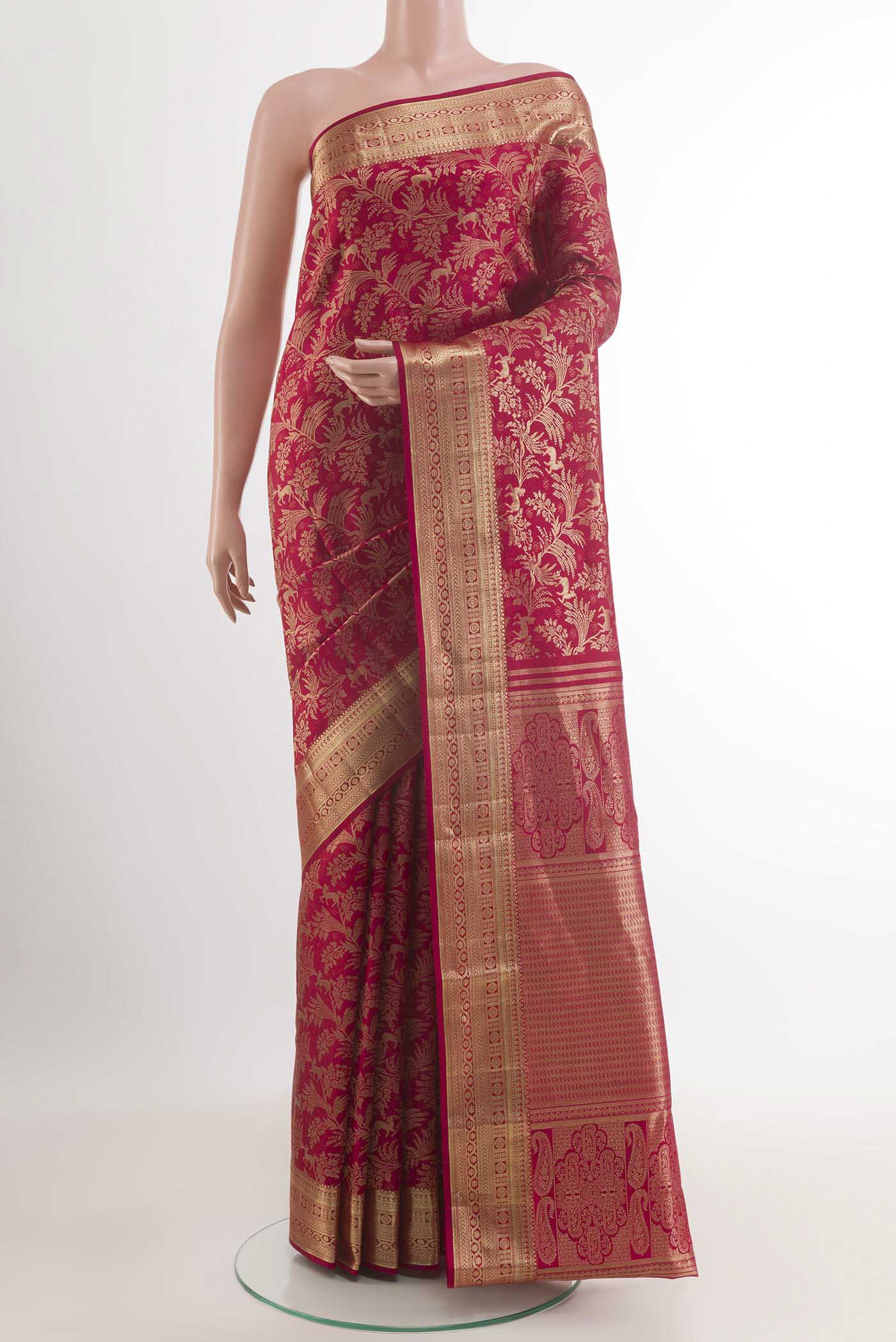 Red Kanjivaram Silk Saree with Zari Brocade on the body and Zari Border.  displayed on a mannequin