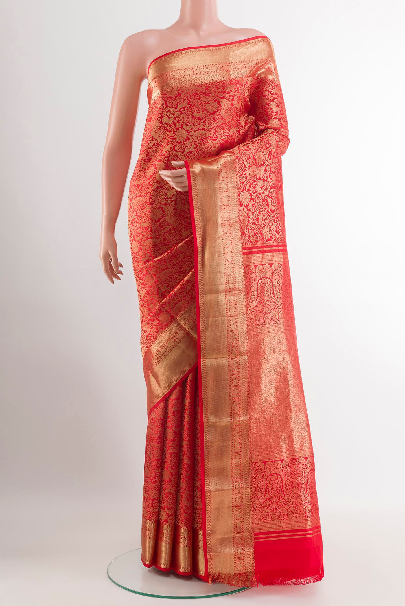 Red Kanjivaram Silk Saree with Zari Brocade on the body and Zari Border.  displayed on a mannequin