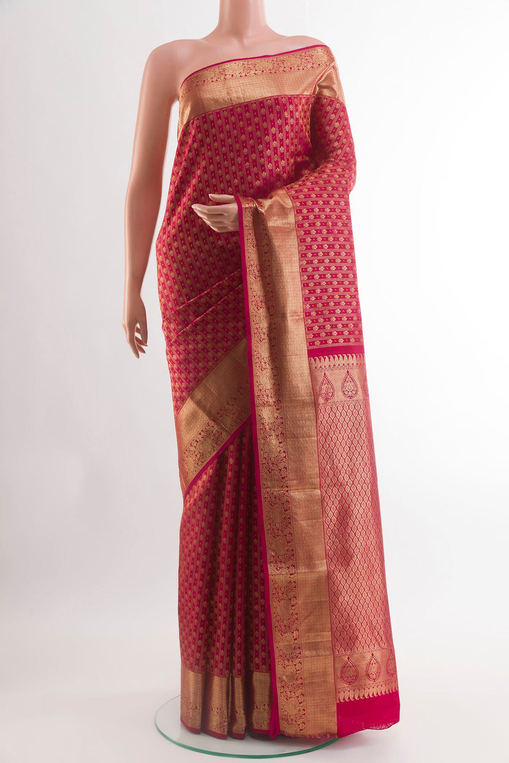 Red Kanjivaram Silk Saree with Zari Butta on the body and Zari Border.  displayed on a mannequin
