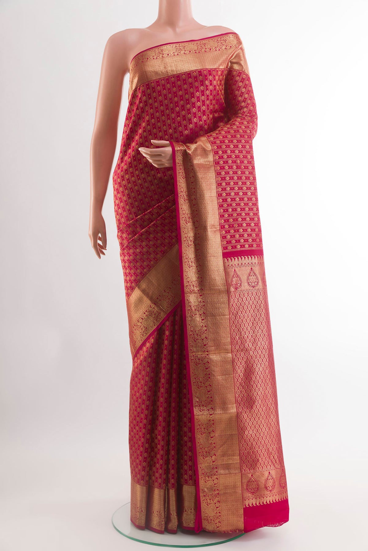 Red Kanjivaram Silk Saree with Zari Butta on the body and Zari Border.  displayed on a mannequin