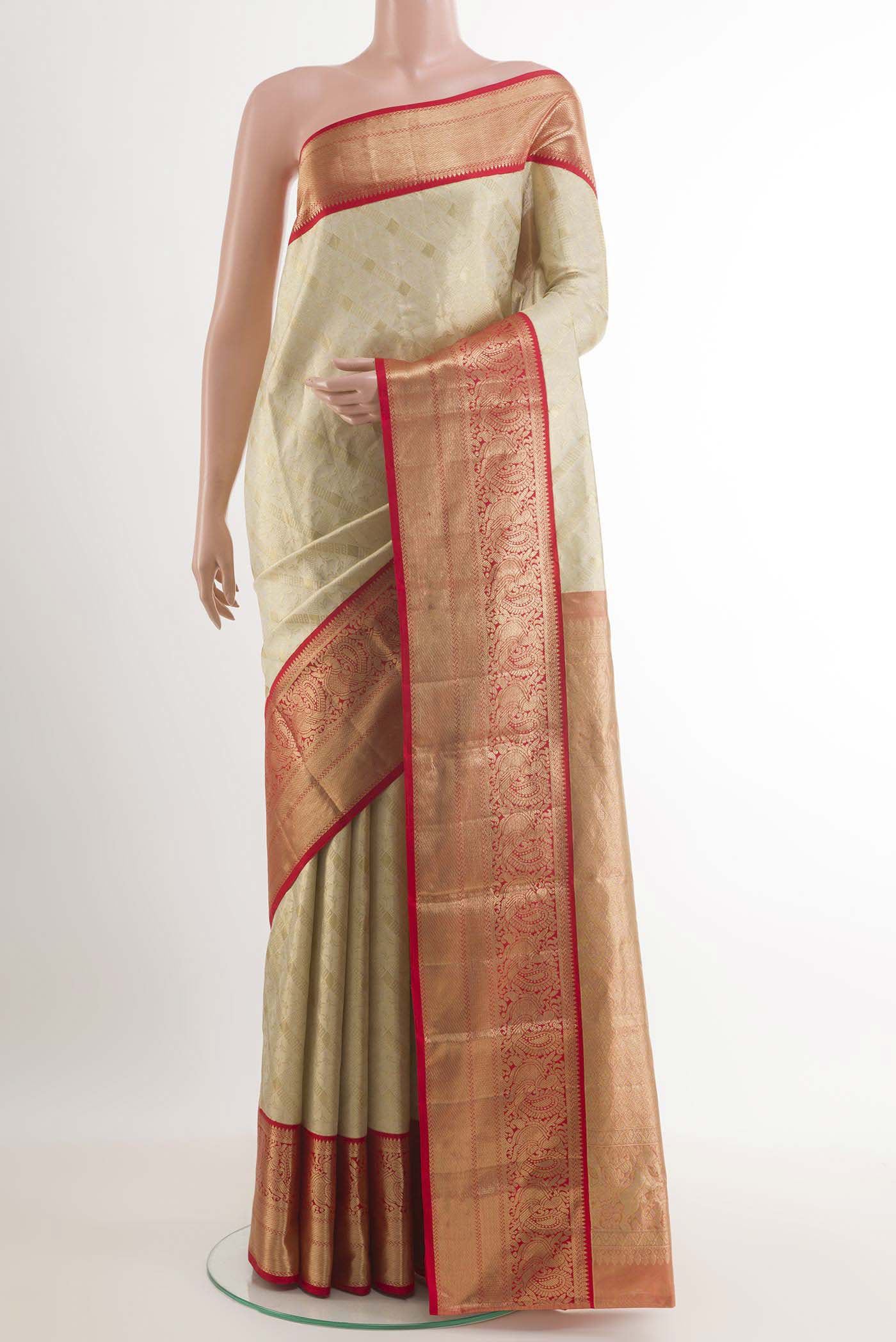 Off White Kanchipuram Silk Saree with Zari Brocade on the body and Zari Border.  displayed on a mannequin