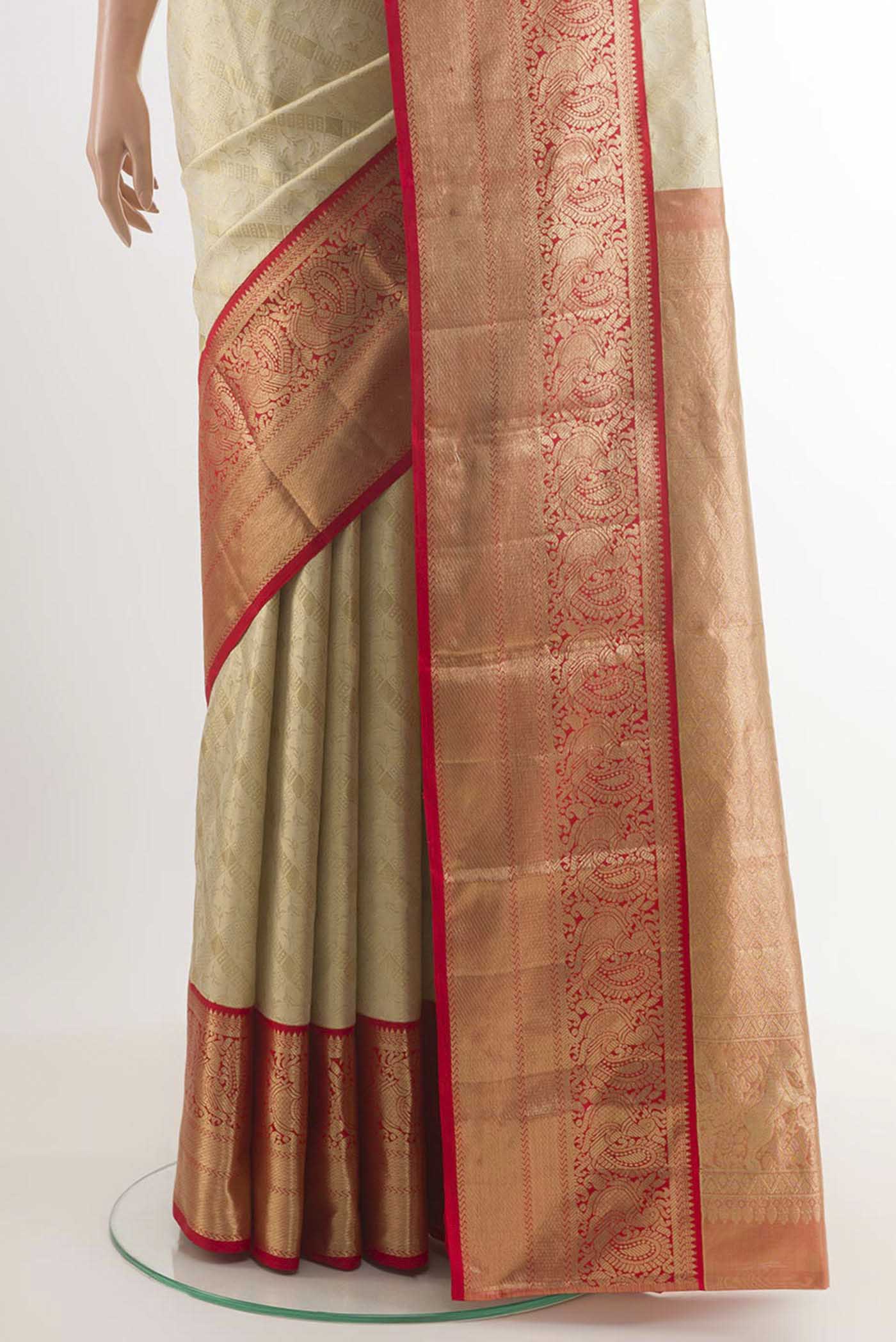 Pleats and pallu of Off White Kanchipuram Silk Saree with Zari Brocade on the body and Zari Border. 