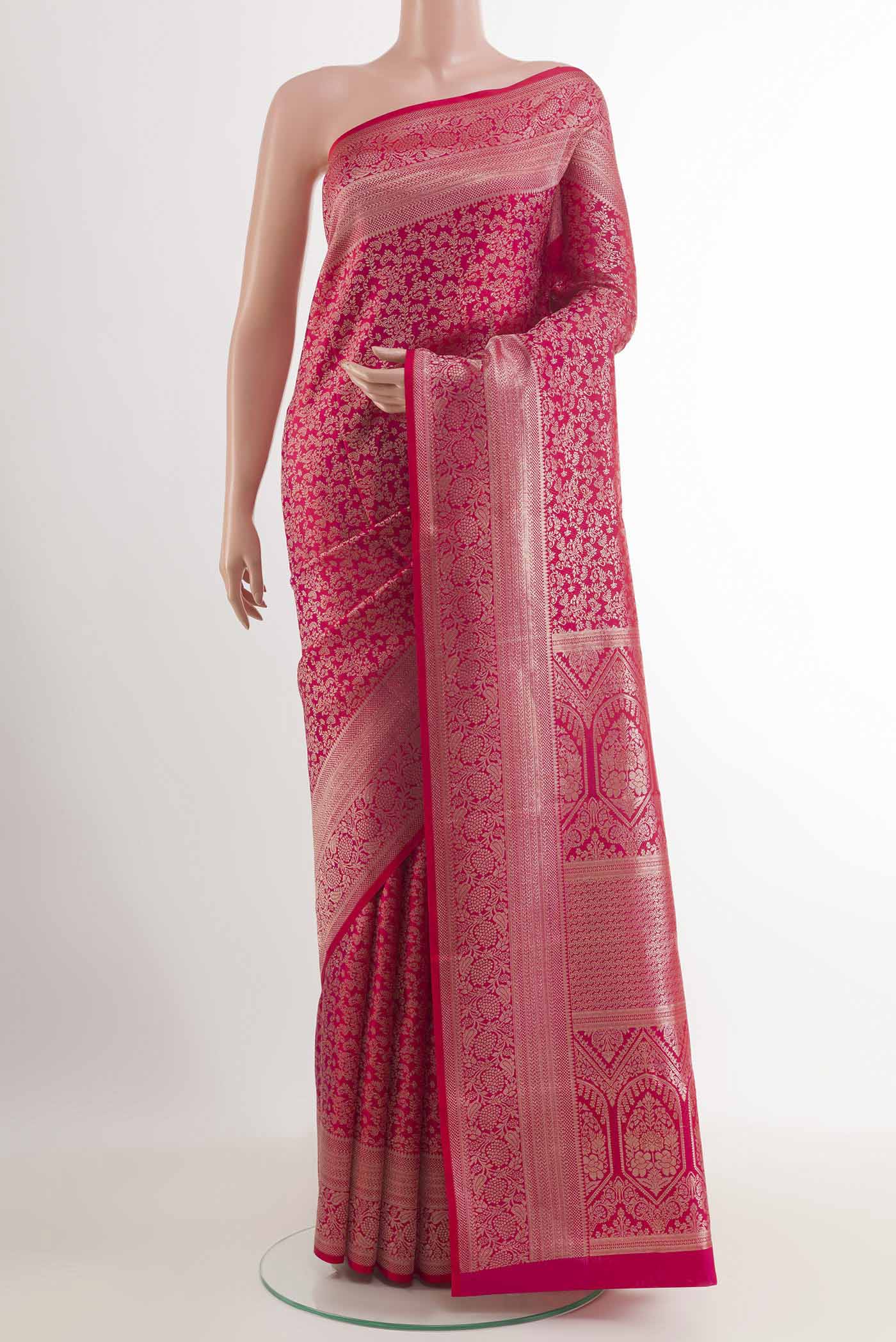 Red Kanchipuram Silk Saree with Zari Brocade on the body and Zari Border.  displayed on a mannequin