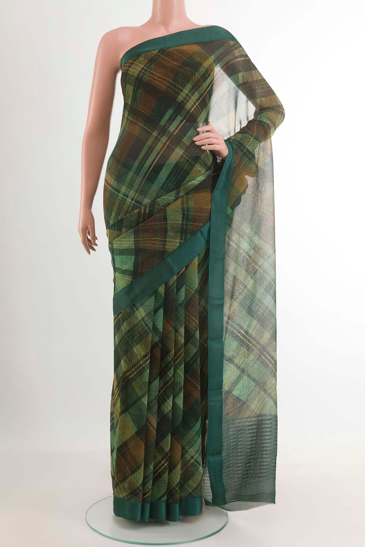 Green Mysore Chiffon Saree with Printed design on the body and Plain Border.  displayed on a mannequin