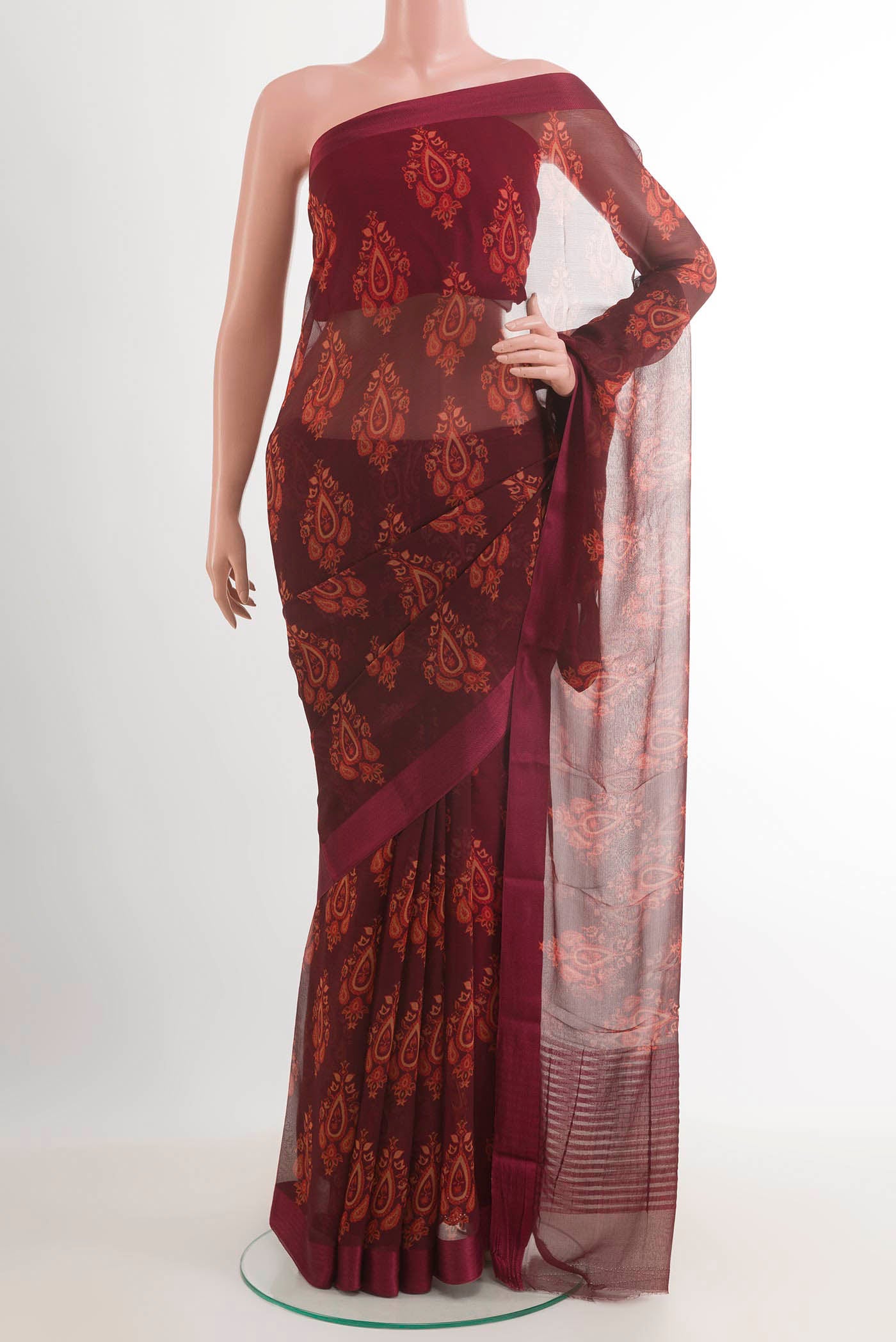 Maroon Mysore Chiffon Saree with Printed design on the body and Plain Border.  displayed on a mannequin