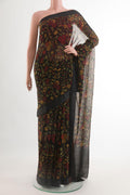 Black Chiffon Saree with Printed design on the body and Zari Border.  displayed on a mannequin