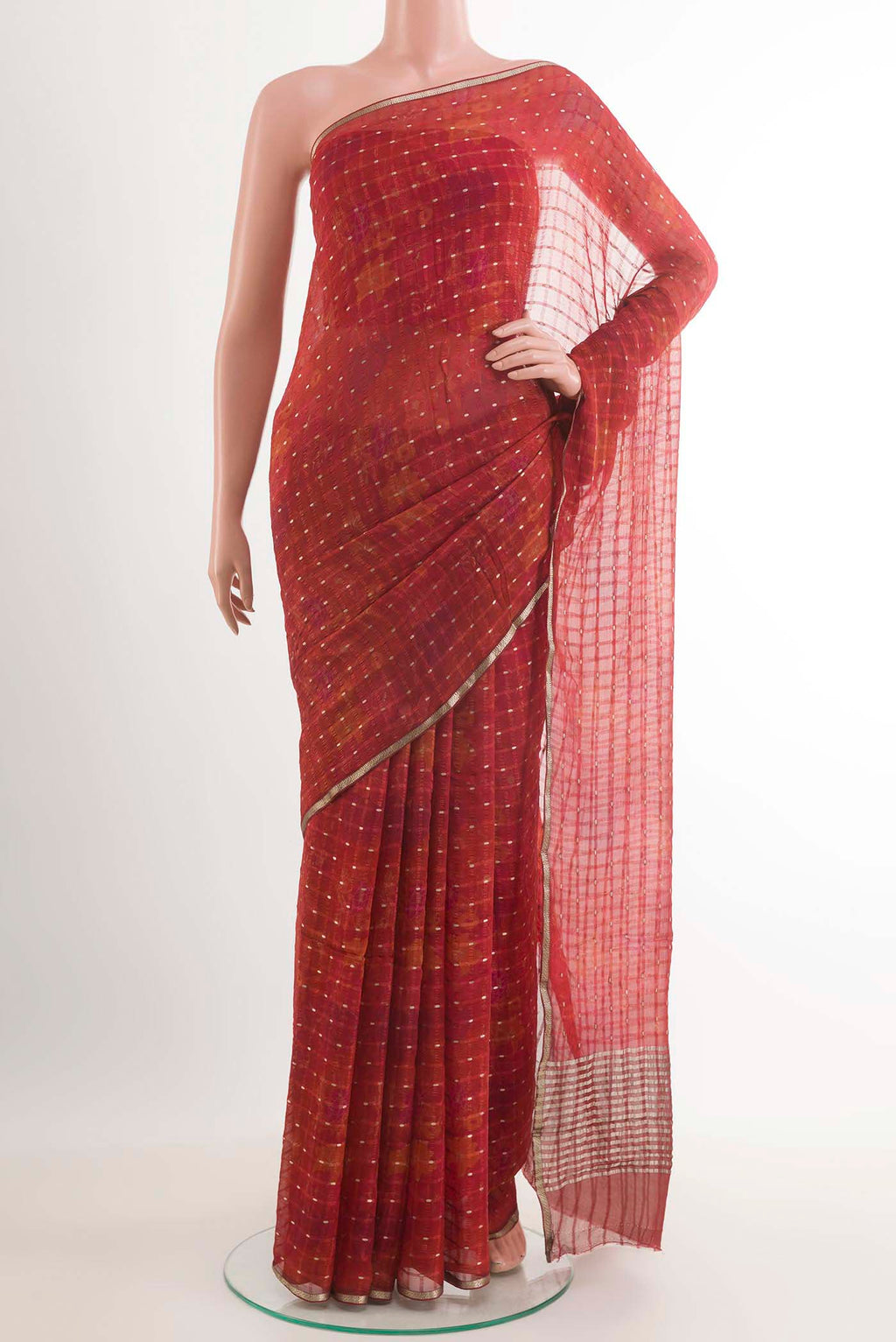 Red Mysore Crepe Saree with Zari Butta on the body and Zari Border.  displayed on a mannequin