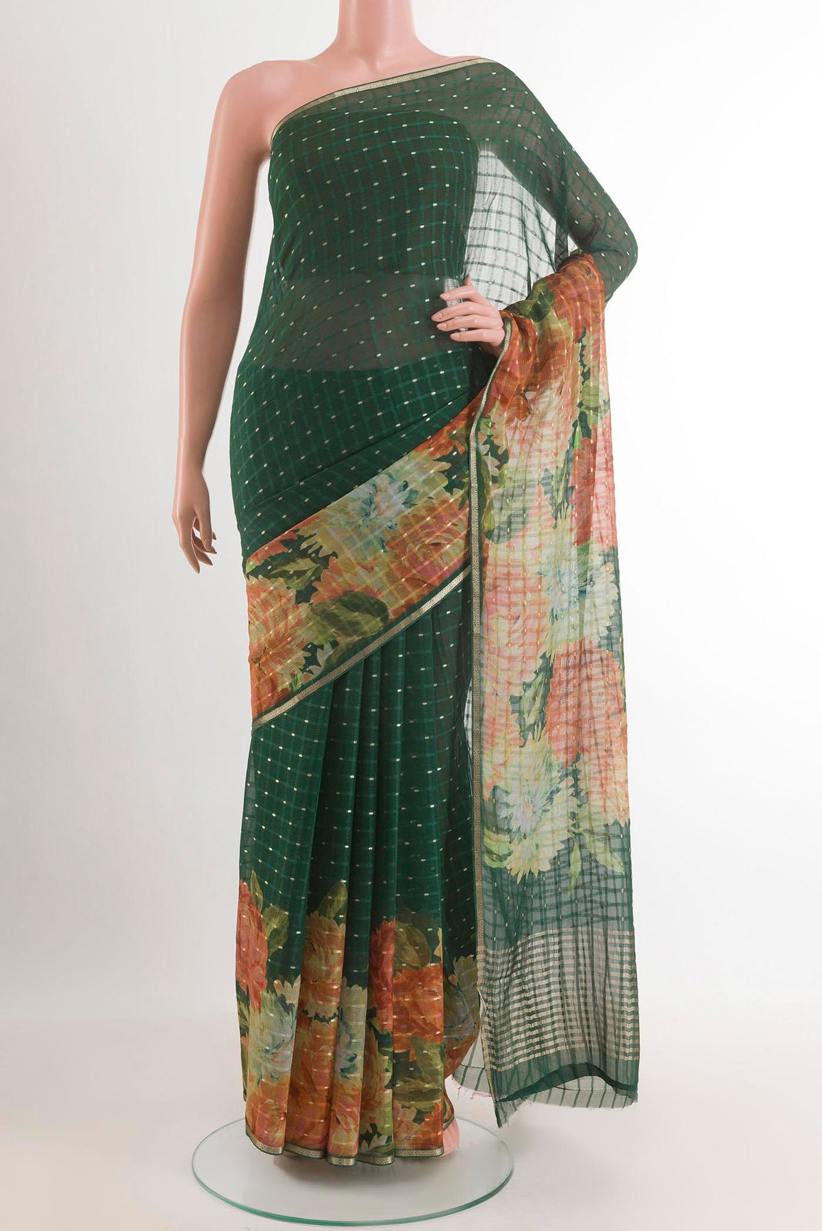 Green Mysore Chiffon Saree with Zari Butta on the body and Zari Border.  displayed on a mannequin