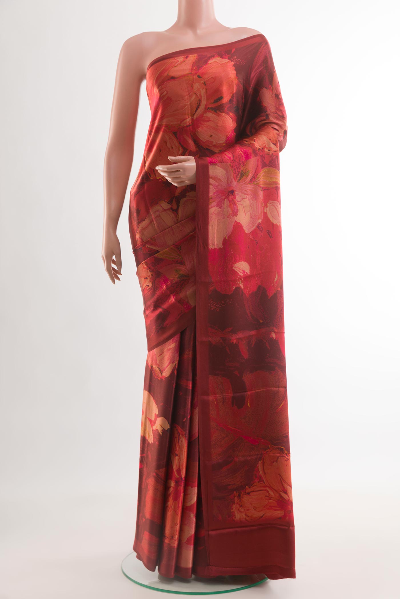 Rust Satin Silk Saree with Floral Print on the body and Without Border.  displayed on a mannequin