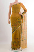 Yellow Mysore Chiffon Saree with Printed design on the body and Zari Border.  displayed on a mannequin