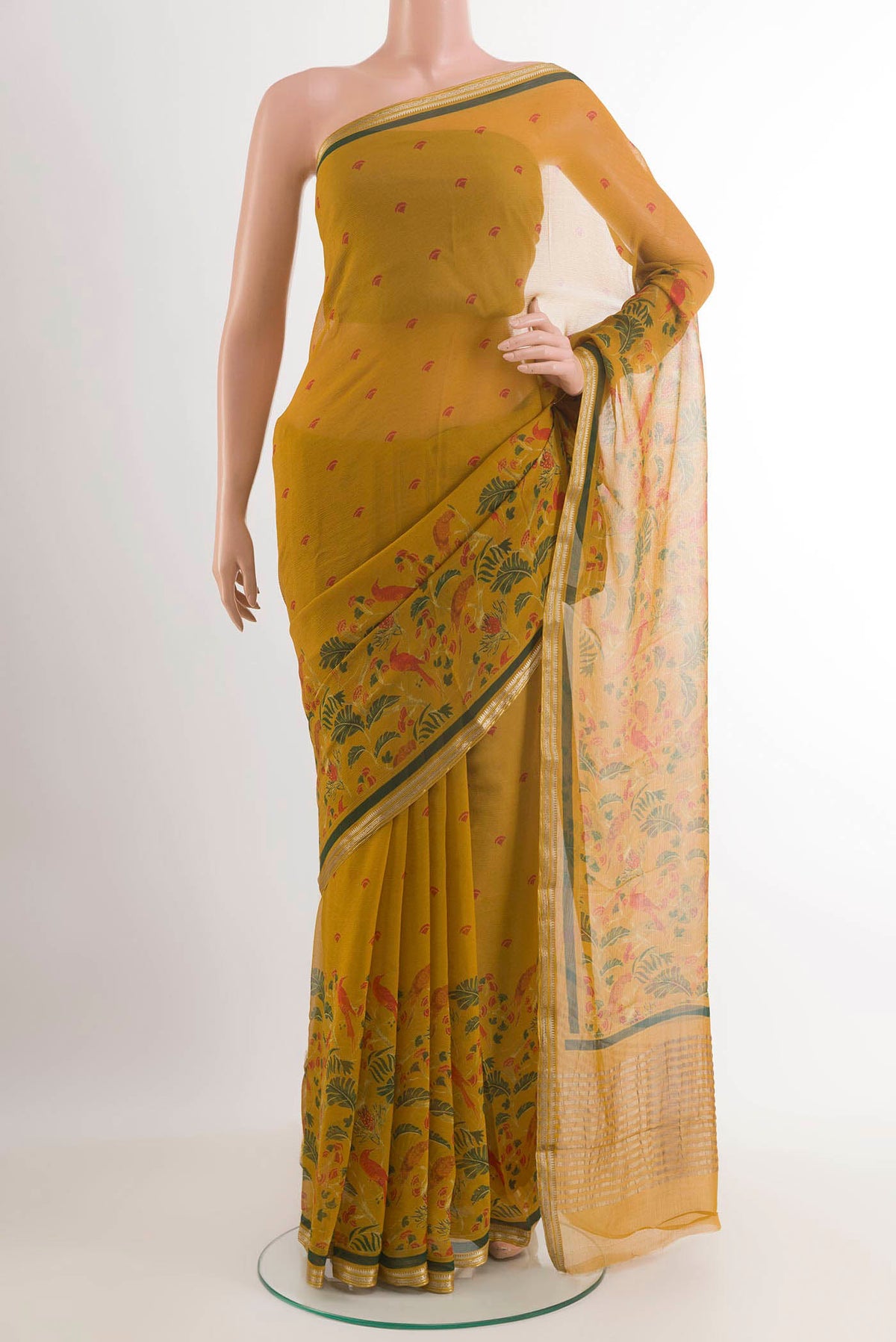 Yellow Mysore Chiffon Saree with Printed design on the body and Zari Border.  displayed on a mannequin