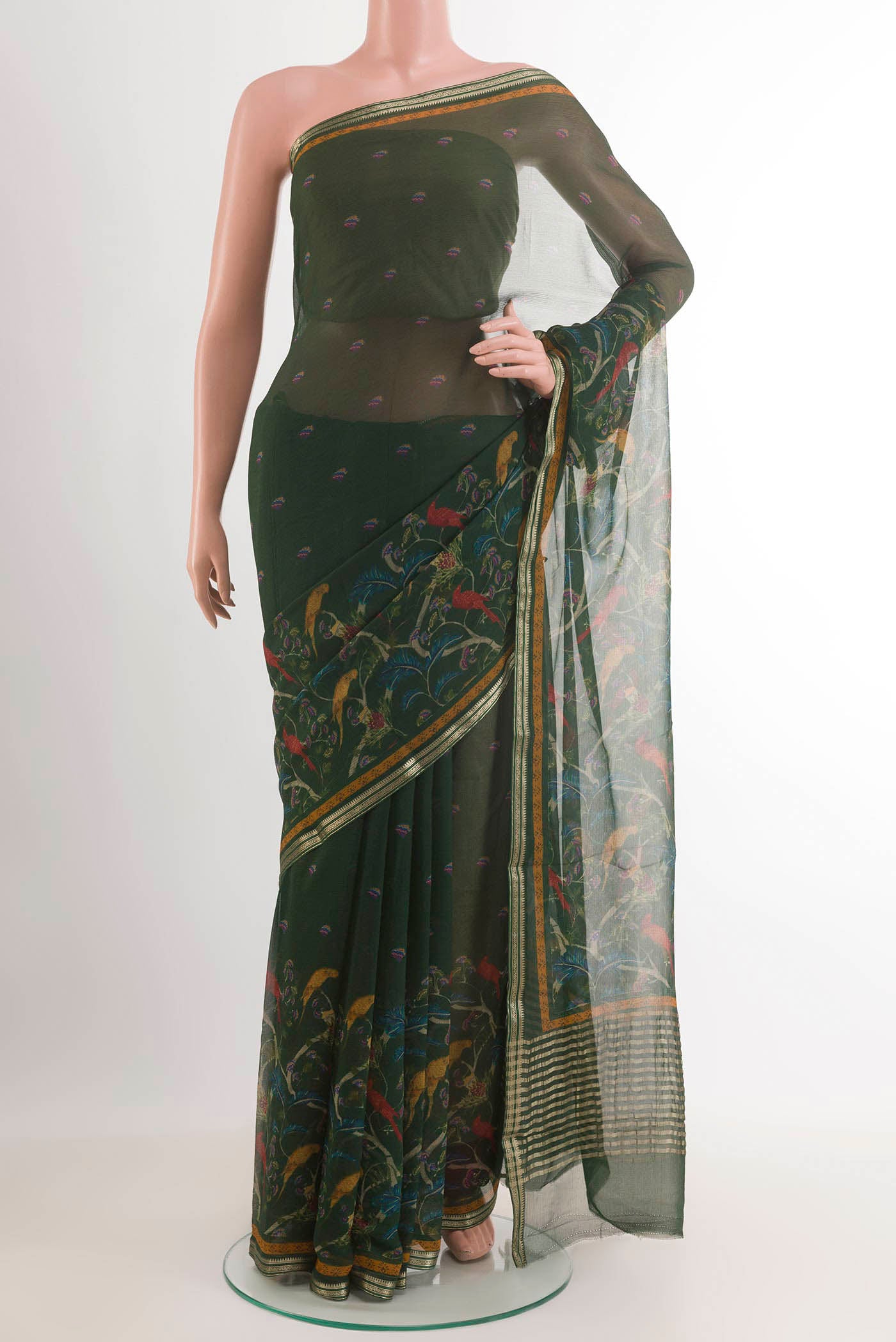 Green Mysore Chiffon Saree with Printed design on the body and Zari Border.  displayed on a mannequin