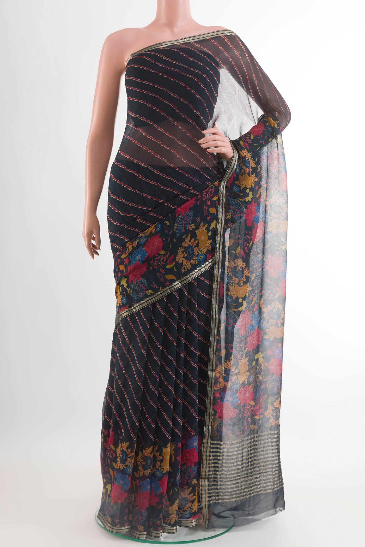Blue Mysore Chiffon Saree with Printed design on the body and Plain Border.  displayed on a mannequin