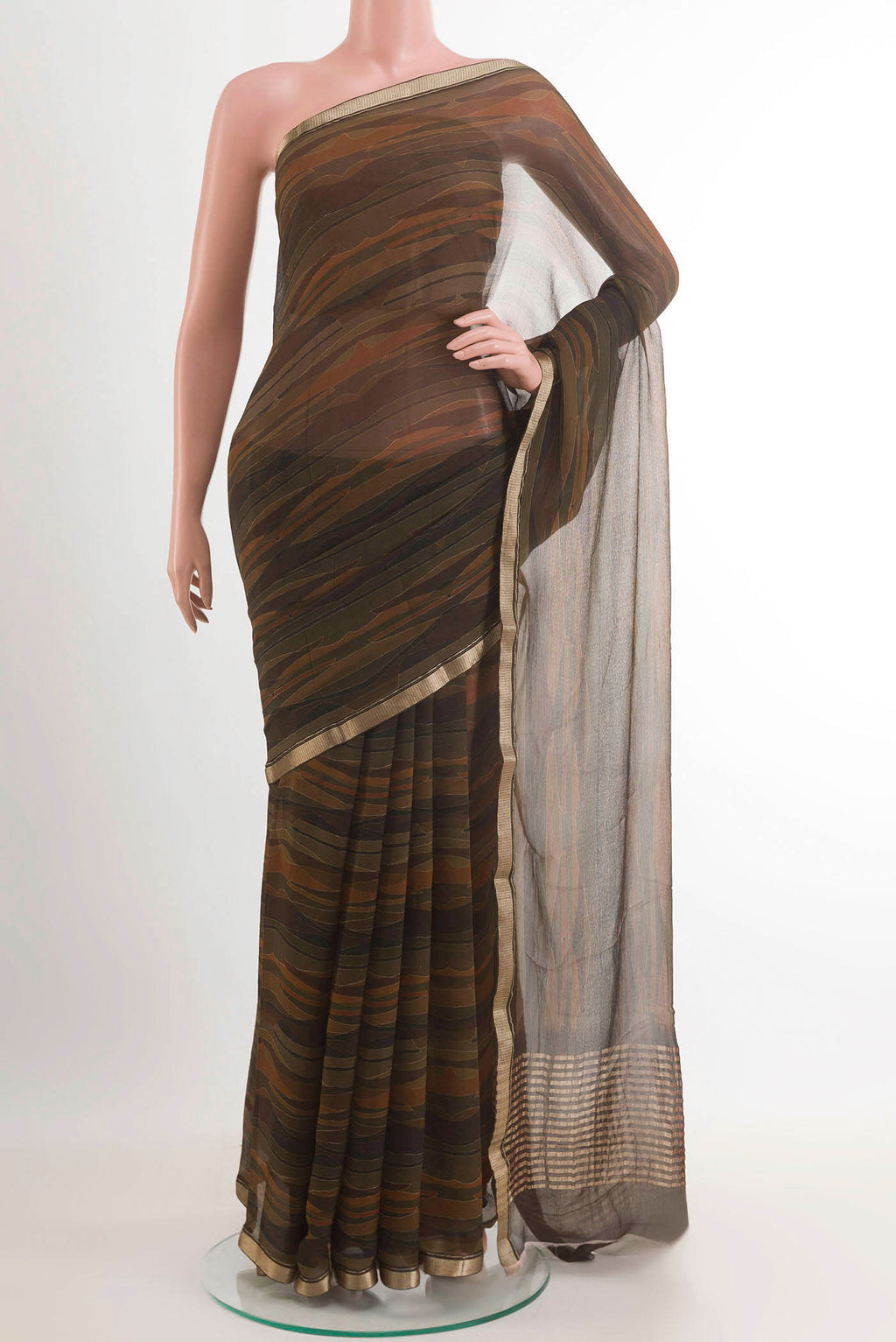 Green Mysore Chiffon Saree with Printed design on the body and Zari Border.  displayed on a mannequin